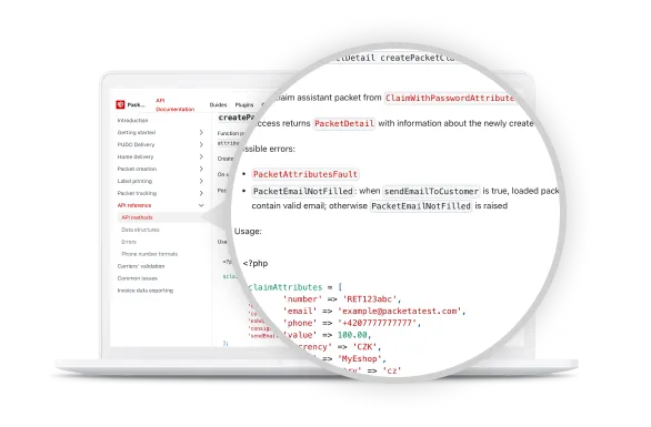 Laptop screen displaying API documentation, with a closer view highlighting PHP code for setting up packet attributes and handling errors.