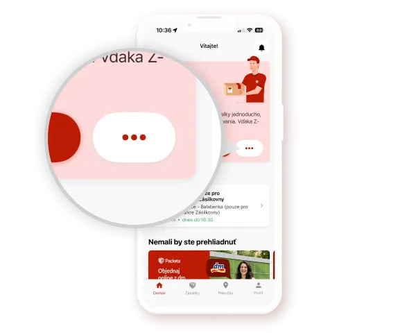 A smartphone screen showing a red-themed app interface with a magnified view of a chat icon featuring three red dots on a white oval background.