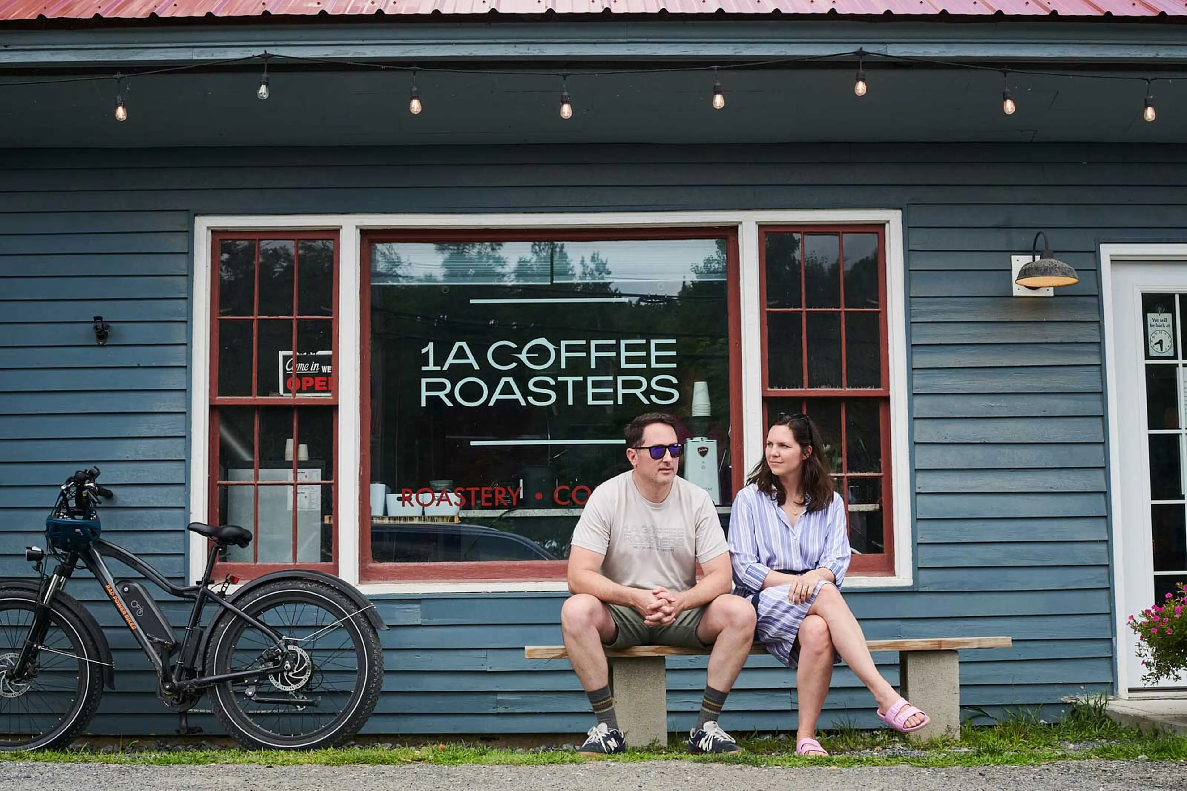 Chrystal and Brian Holt sitting outside of their coffee shop