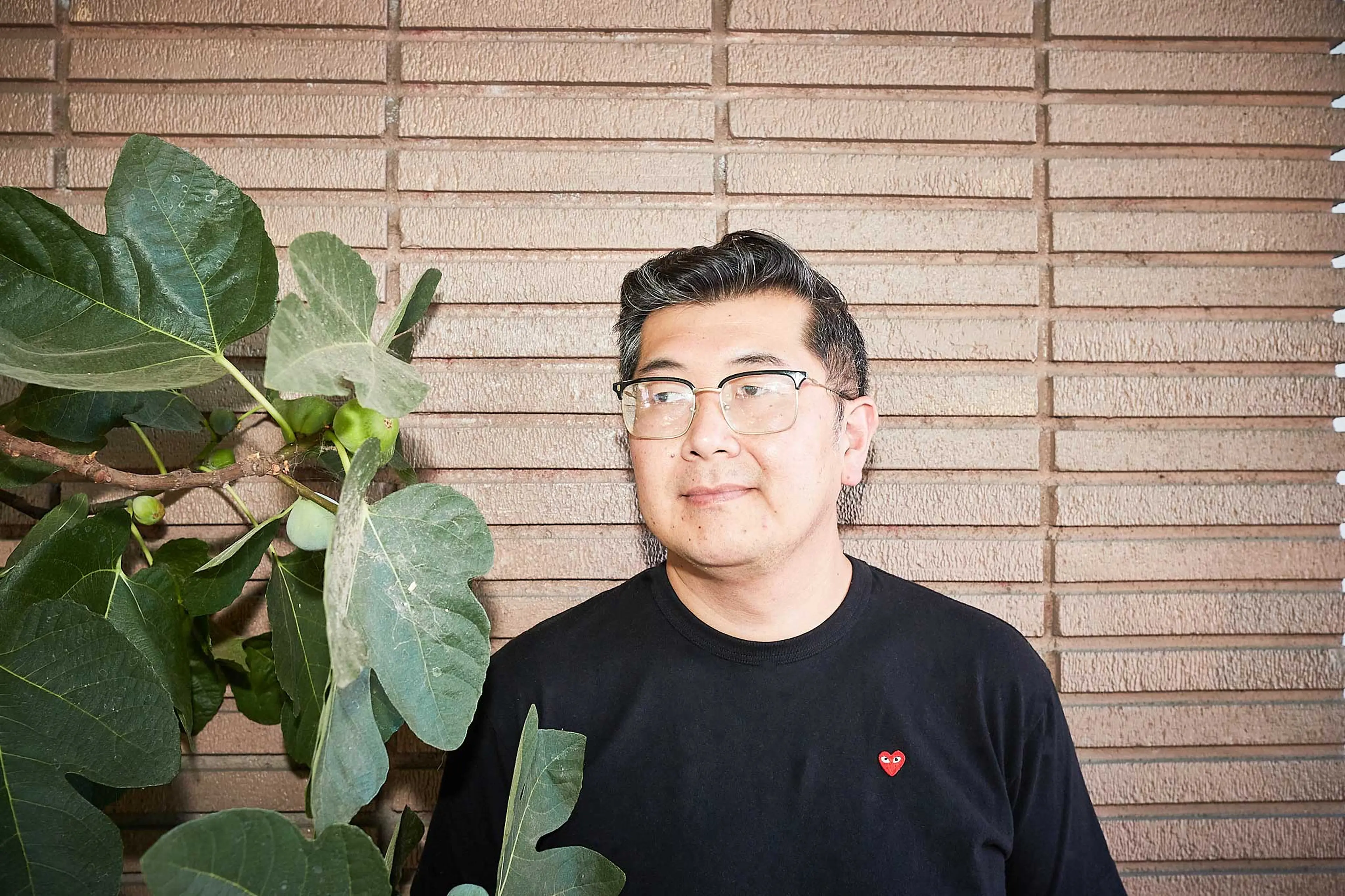 Frank in front of a wall