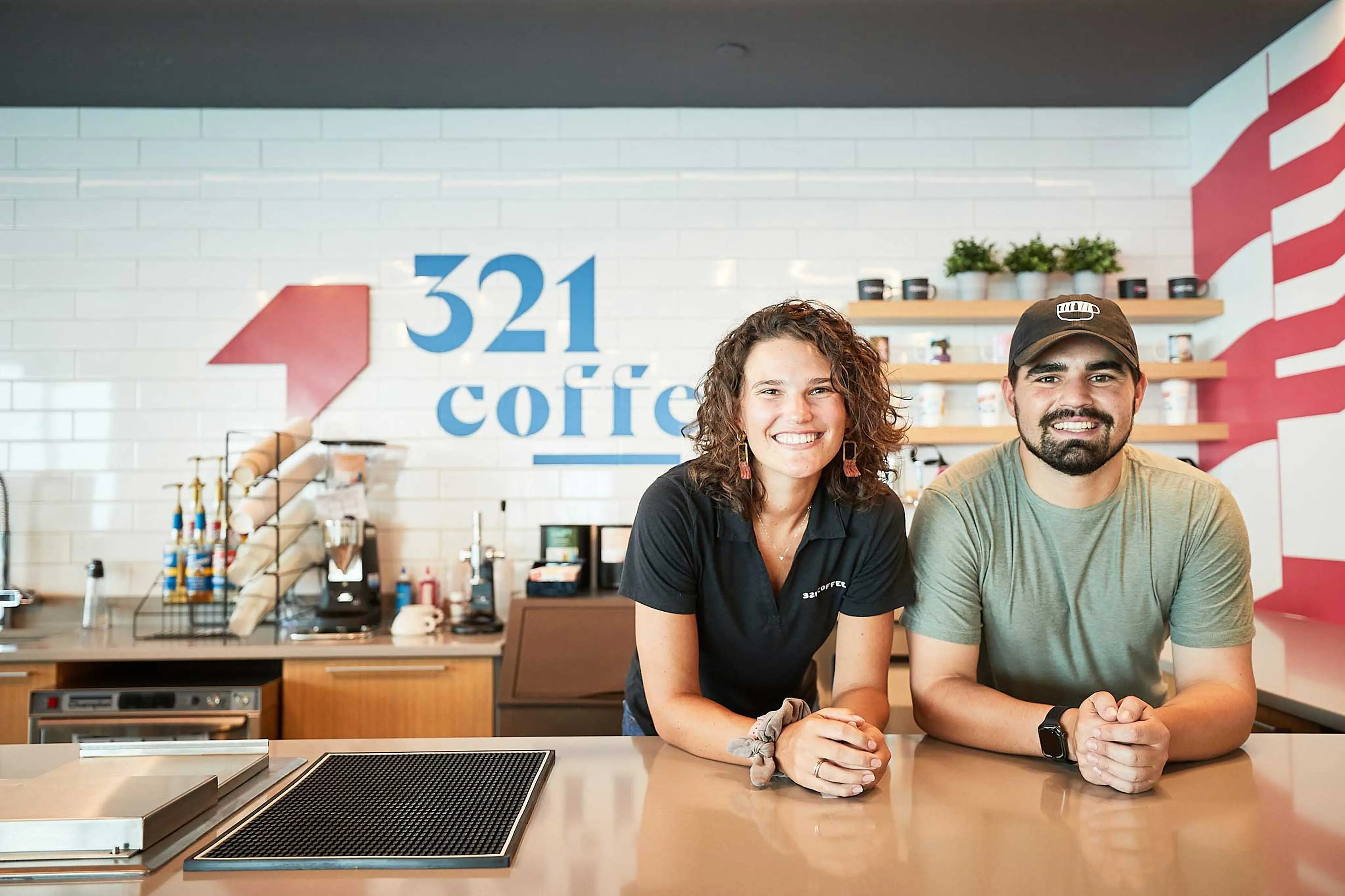 Michael and Lindsey behind a counter