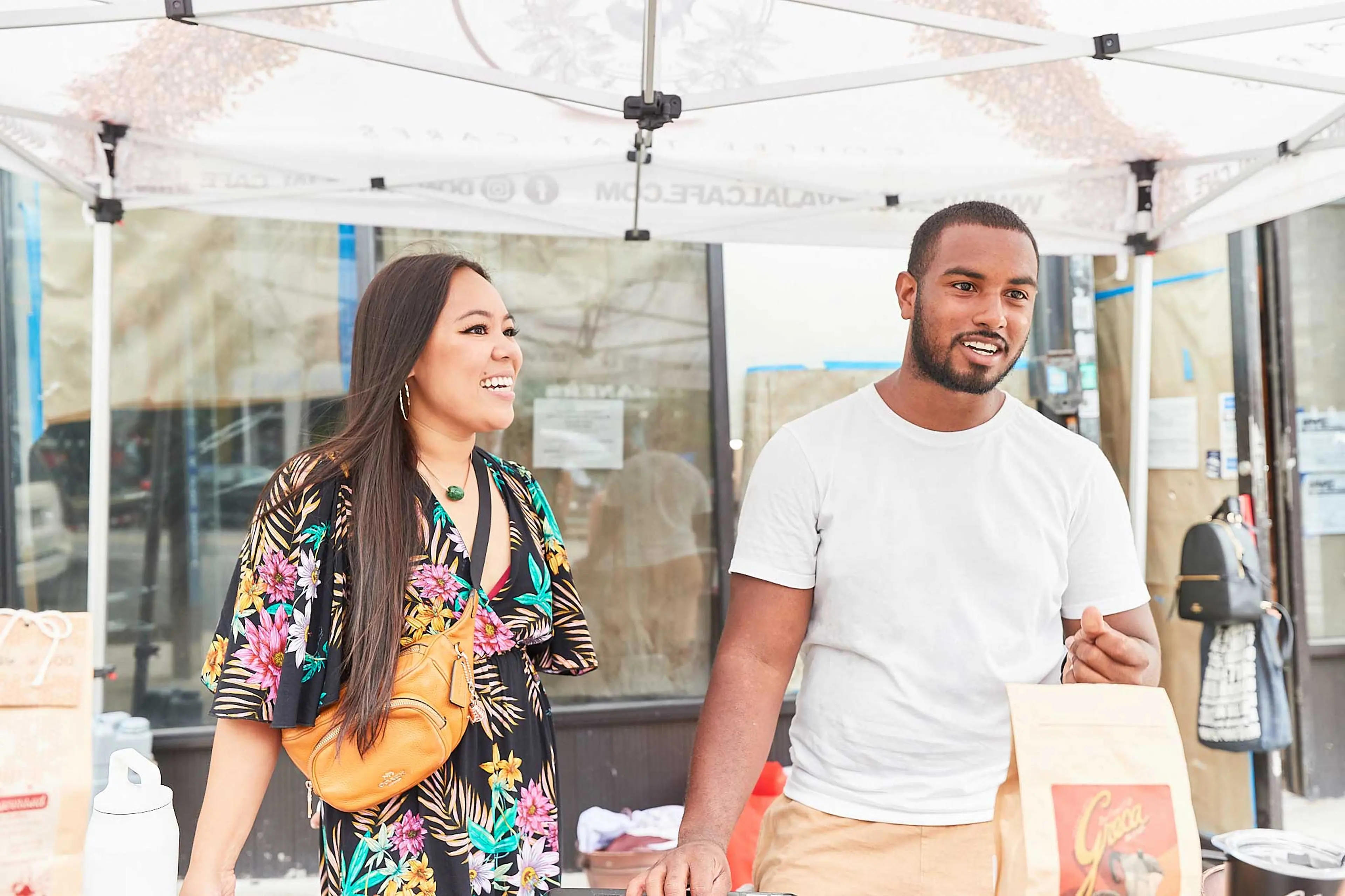 Hector and partner interacting with a customer