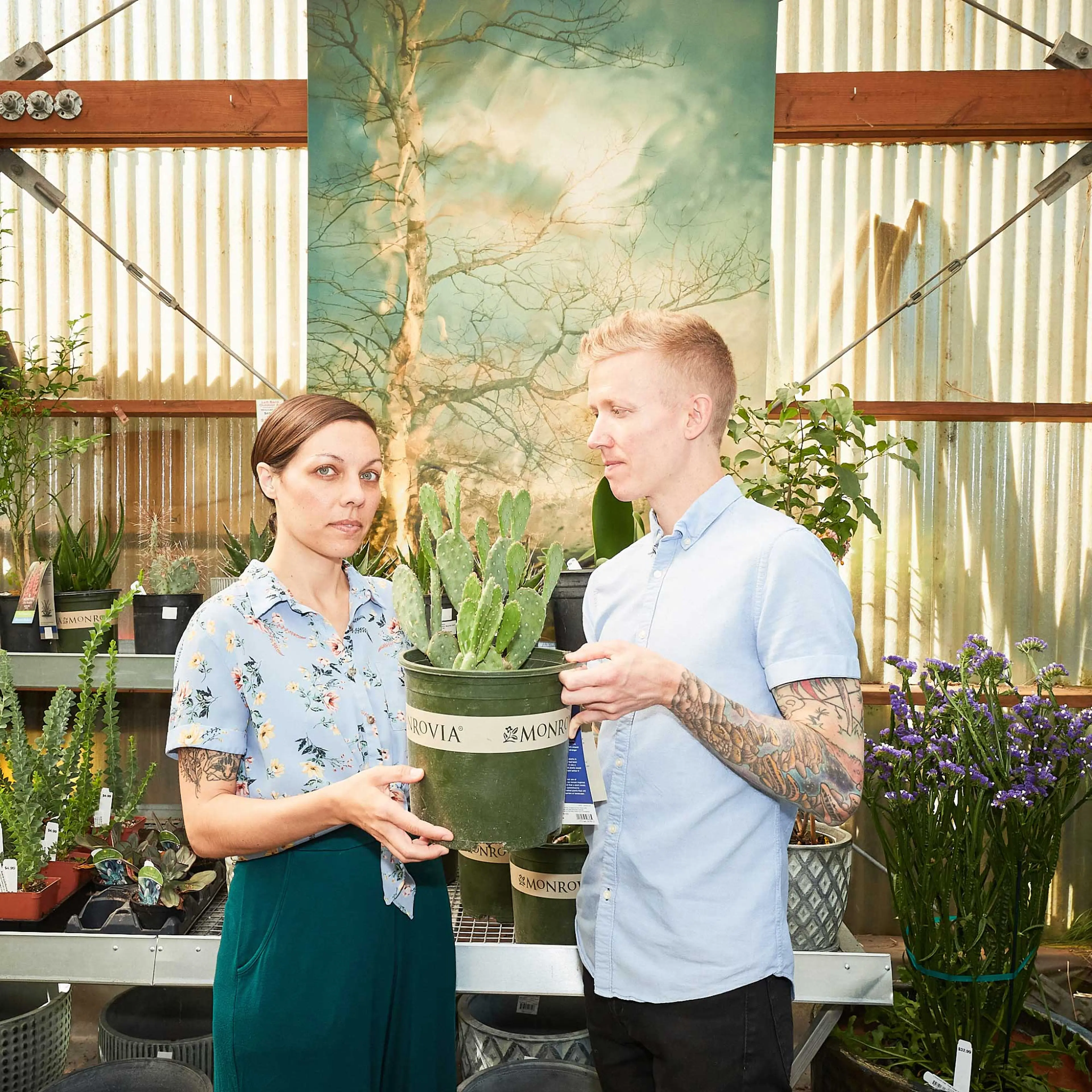 Mike Nelson and Carol Tessitore holding a plant