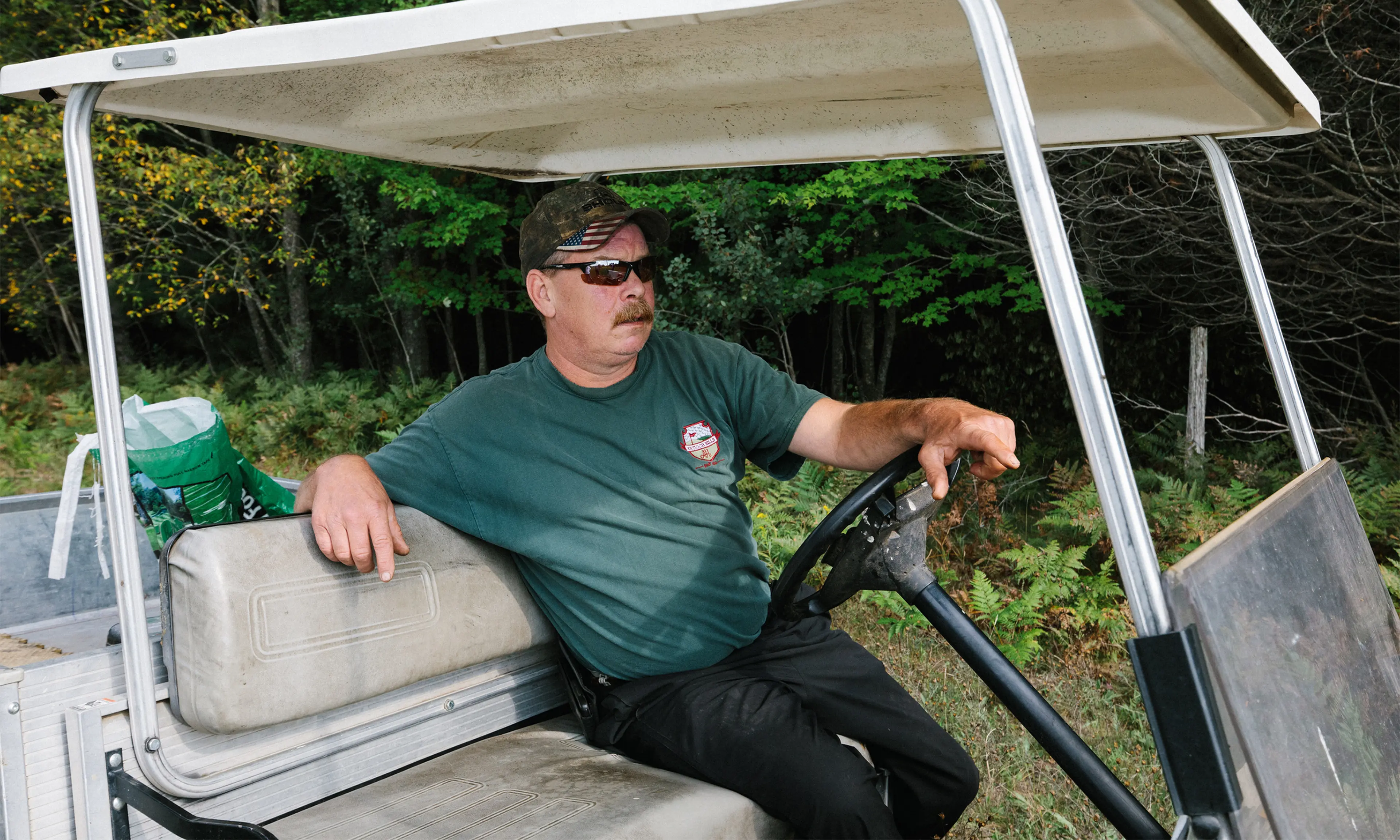 Todd Hoskins in a golf cart
