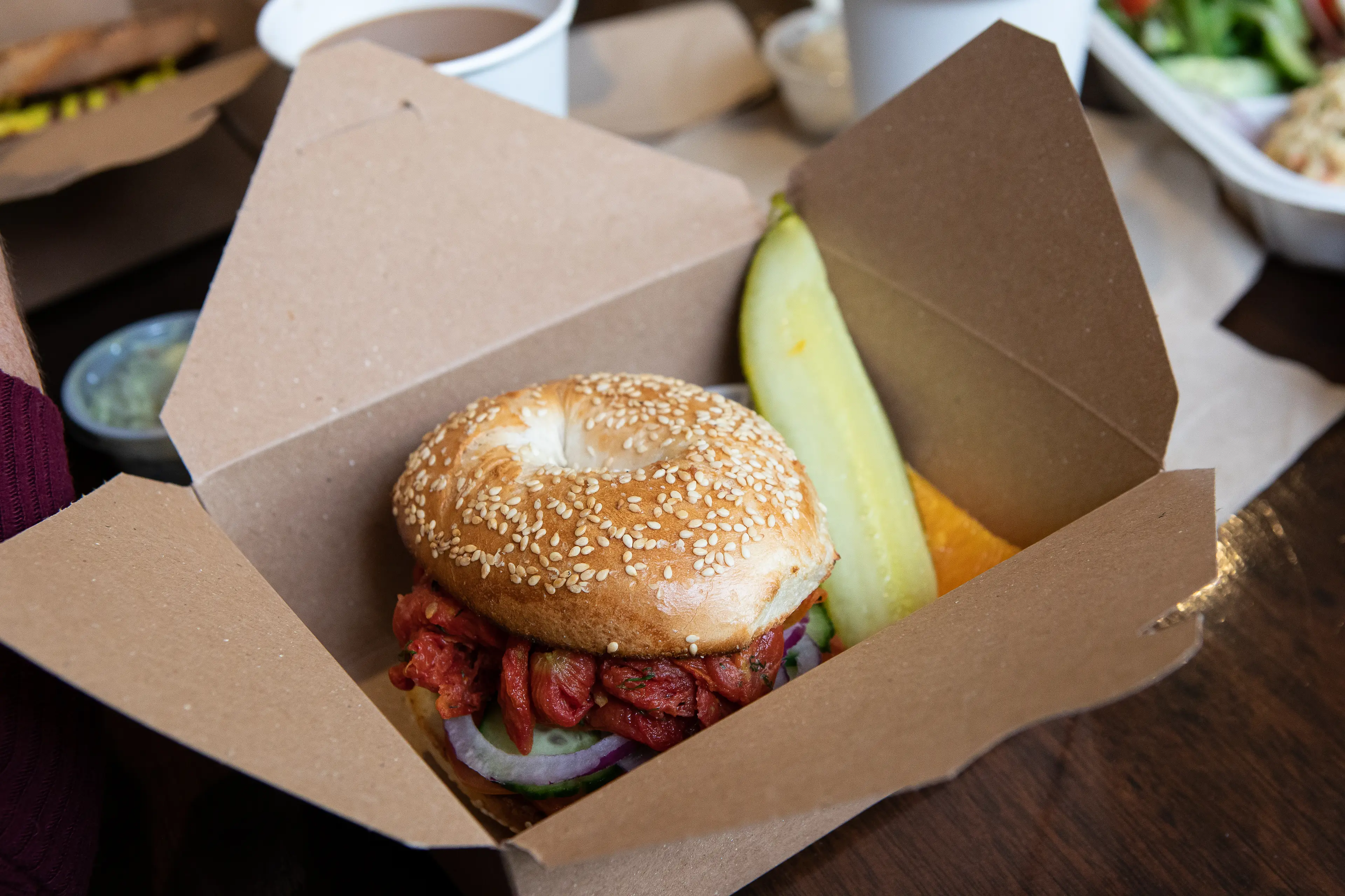 Bagel sandwich and a pickle.