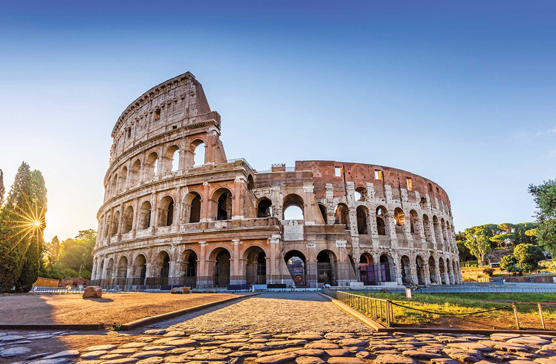 Rome, Italy. The Colosseum or Coliseum at sunrise.