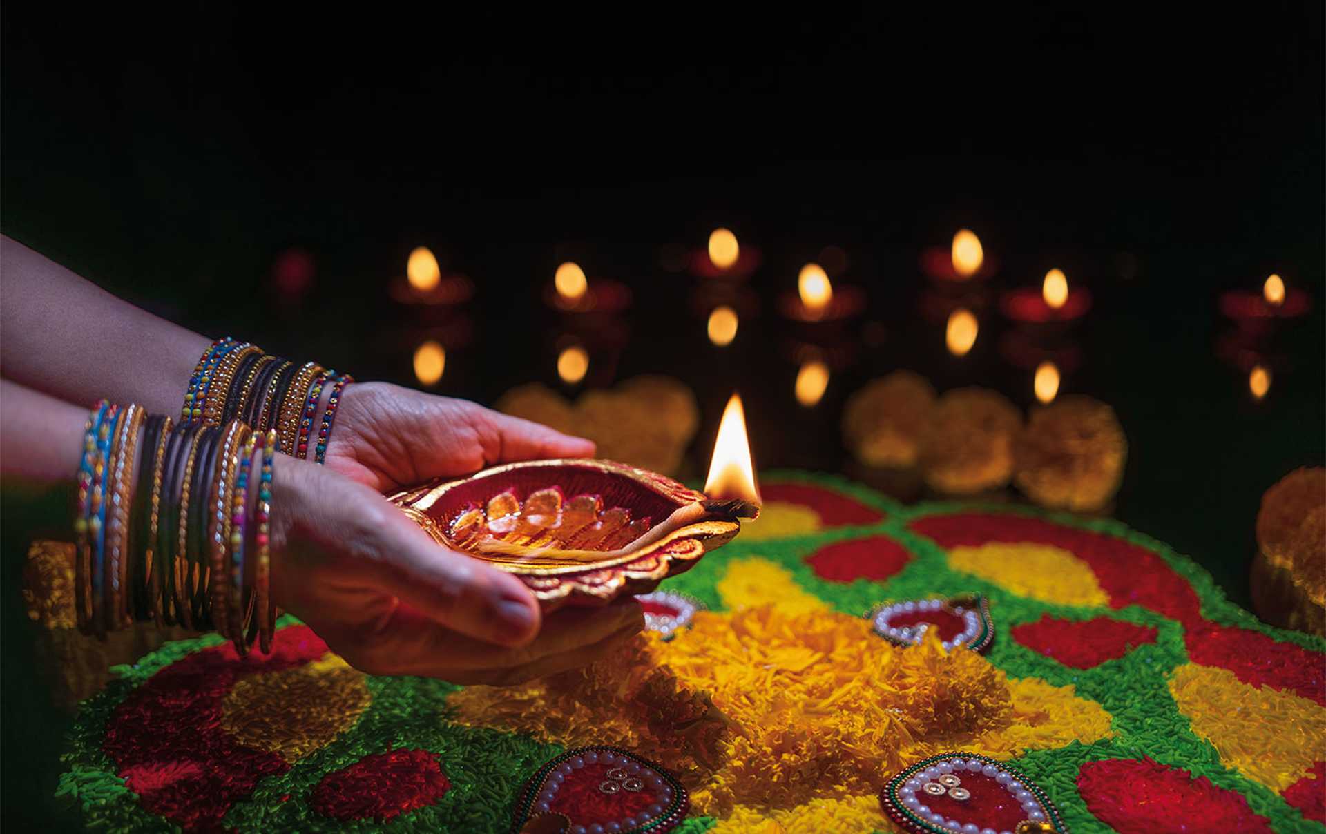 Clay diya lamps lit during diwali celebration, Diwali, or Deepavali, is India's biggest and most important holiday.
