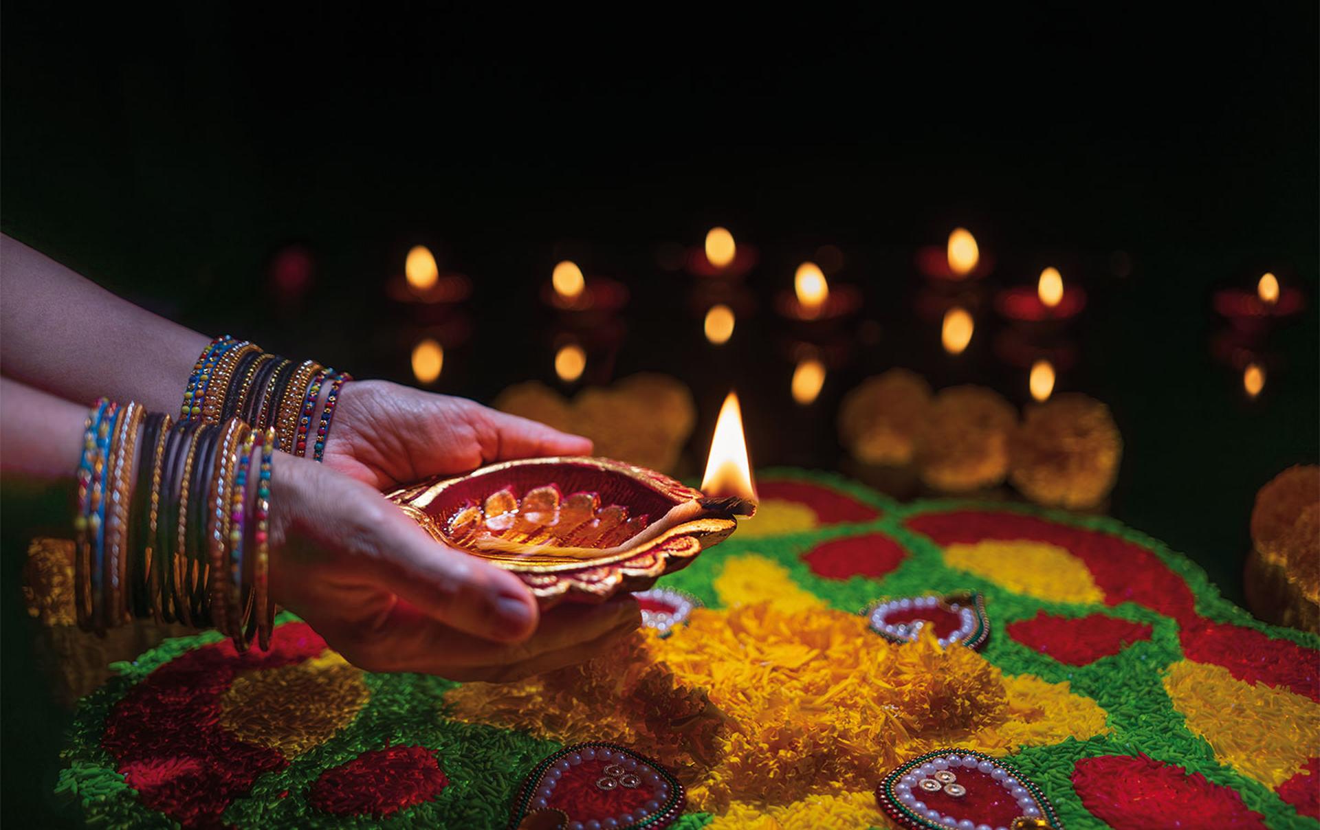 Clay diya lamps lit during diwali celebration, Diwali, or Deepavali, is India's biggest and most important holiday.