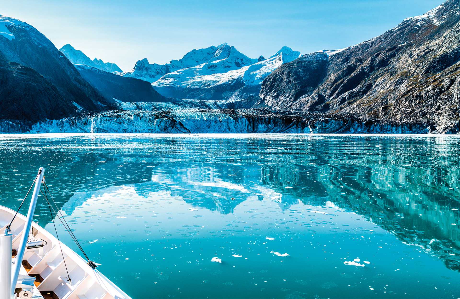 Cruise ship in Glacier Bay cruising towards Johns Hopkins Glacier in Alaska, USA. Panoramic view during summer.