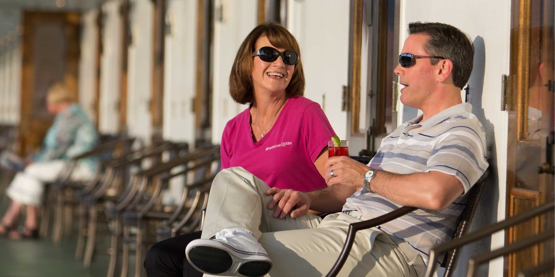 Couple outside on the deck of the American Queen ship