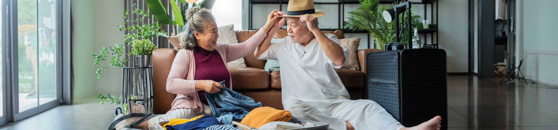 Couple packing for holiday
