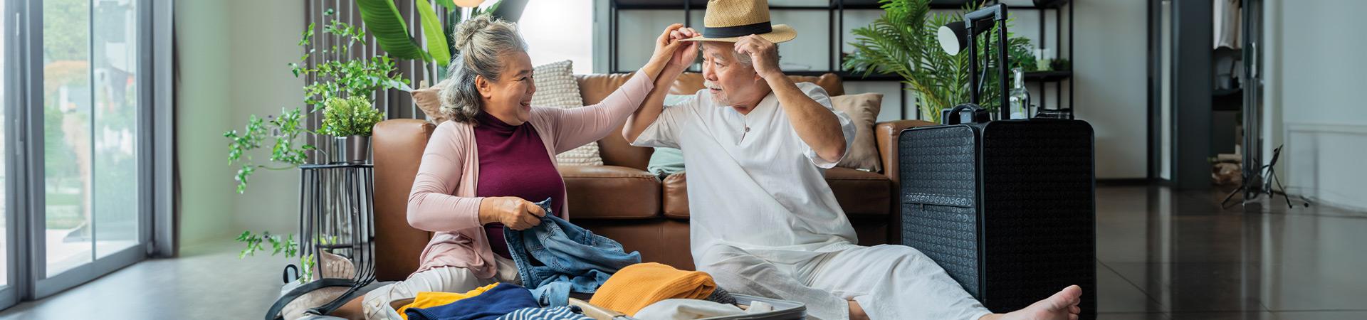 Couple packing for holiday