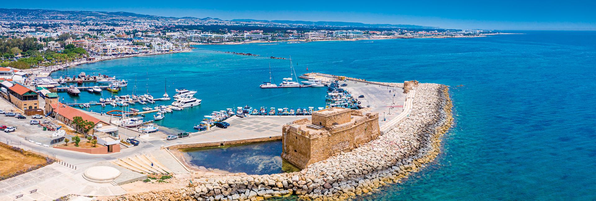 Cyprus. Pathos. The Paphos castle panoramic view from the sea. The medieval port castle in the harbour.