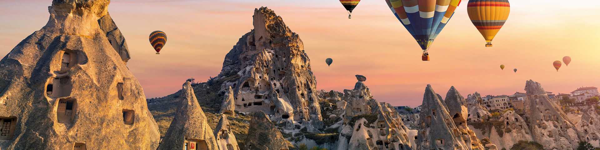 Colourful hot air balloon flying over Cappadocia, Turkey.
