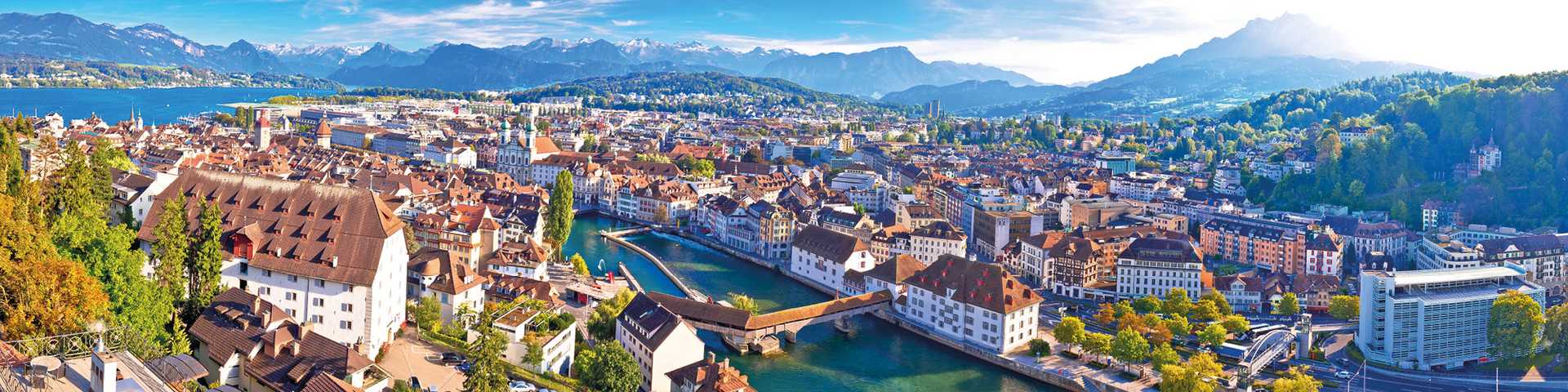 Aerial view over city of Lucerne, Switzerland with alps and lakes in the background
