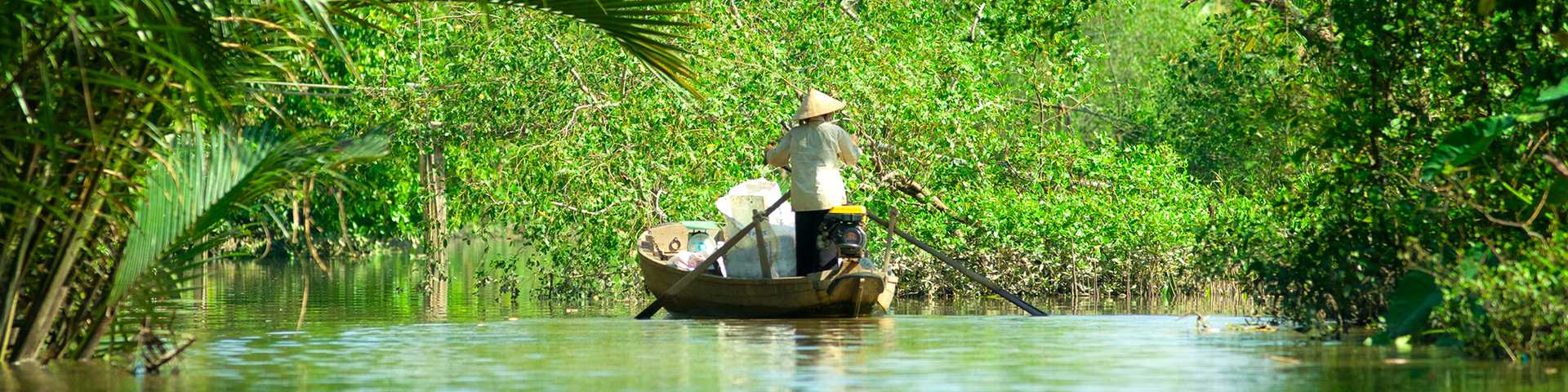 A boat floating through the mangroves in Mekong delta, Can Tho, Vietnam