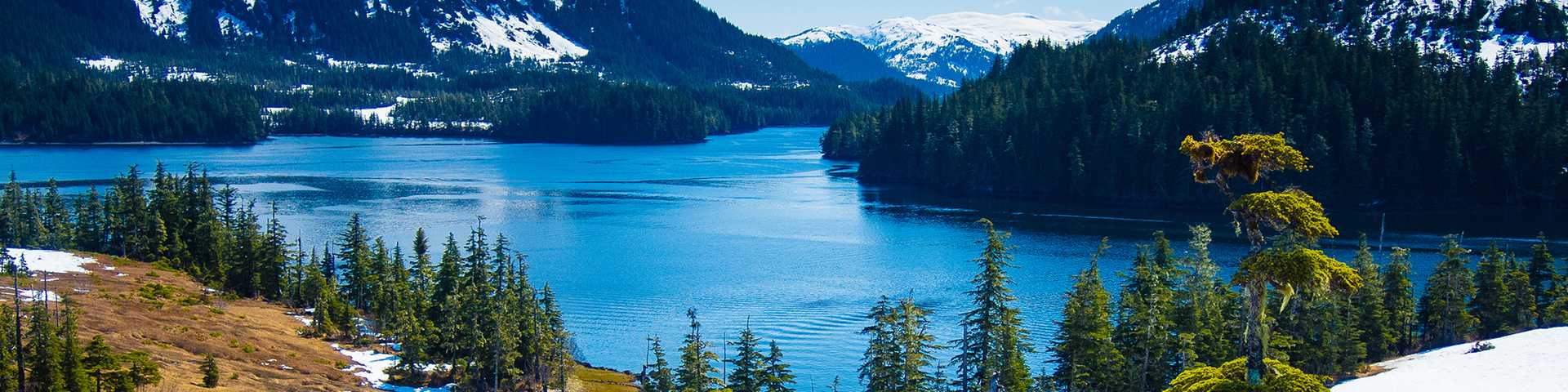 Snowy mountains and alpine lake scenery in Alaska, USA