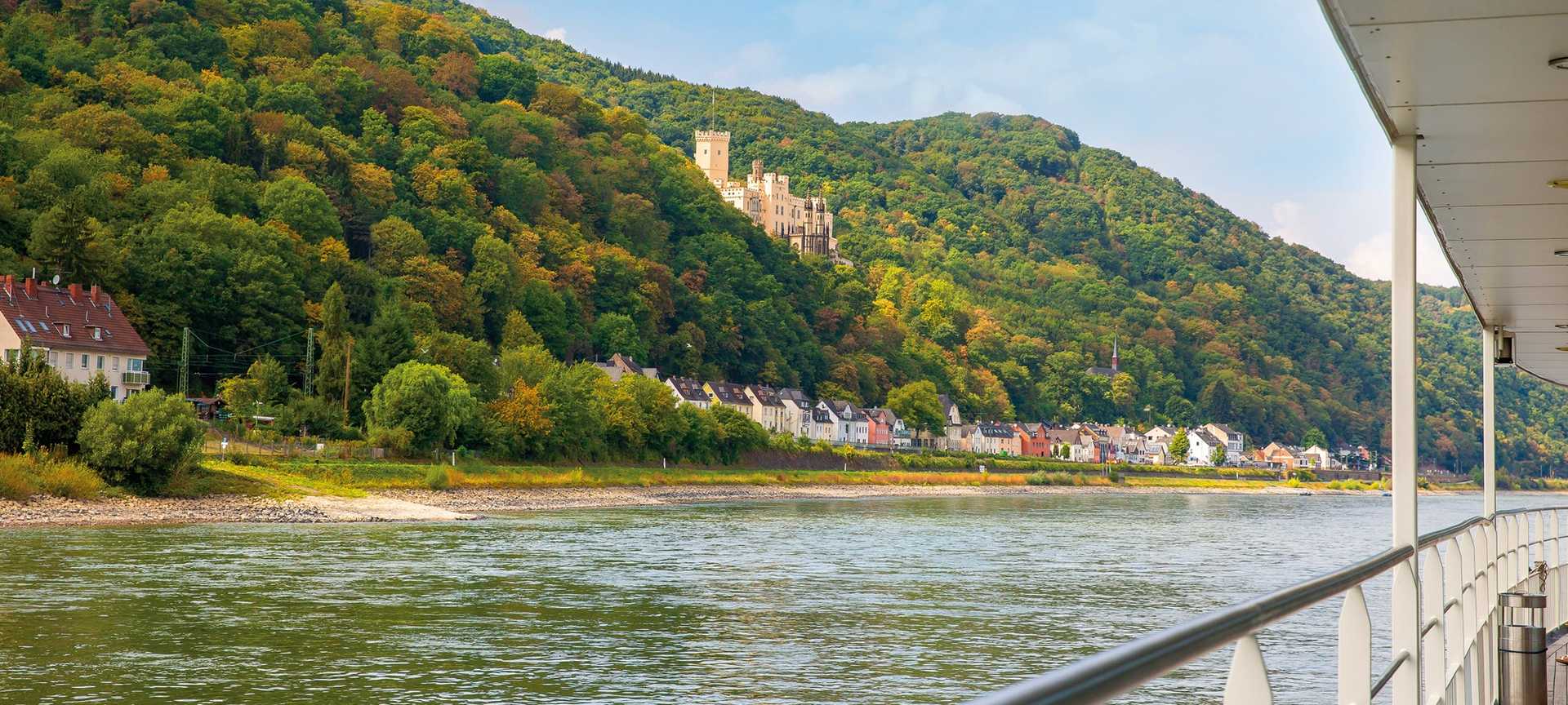 View of a hillside castle along the Rhine, viewed from the deck of MS Bellejour