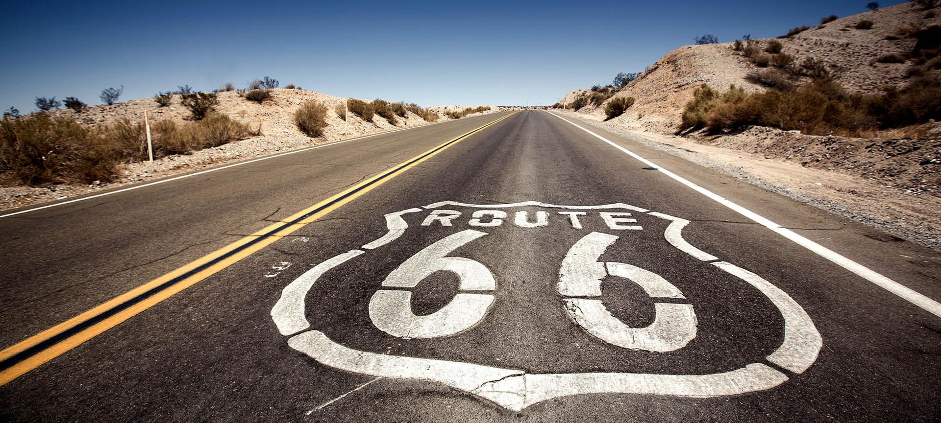 Route 66 sign printed on the road in the Californian desert