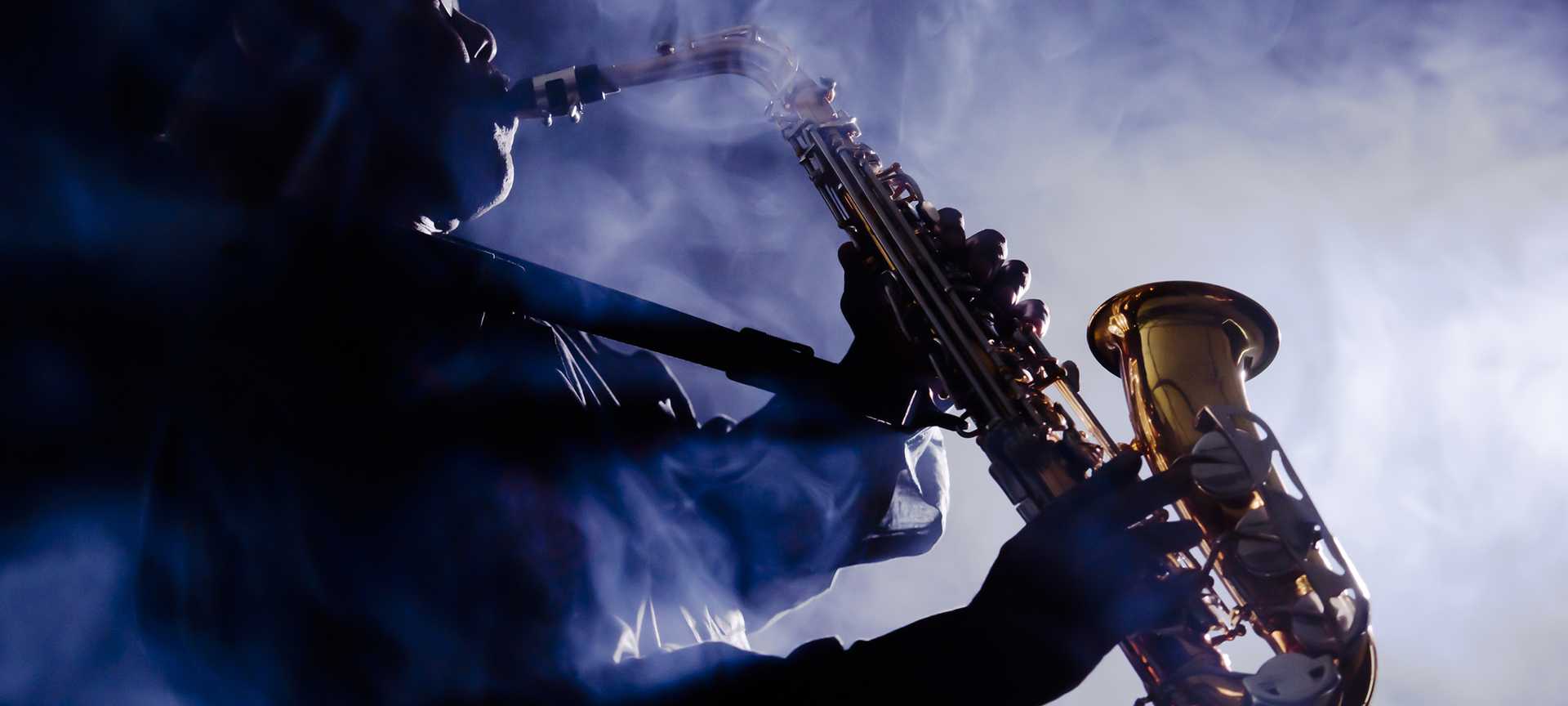 A man plays a saxophone 