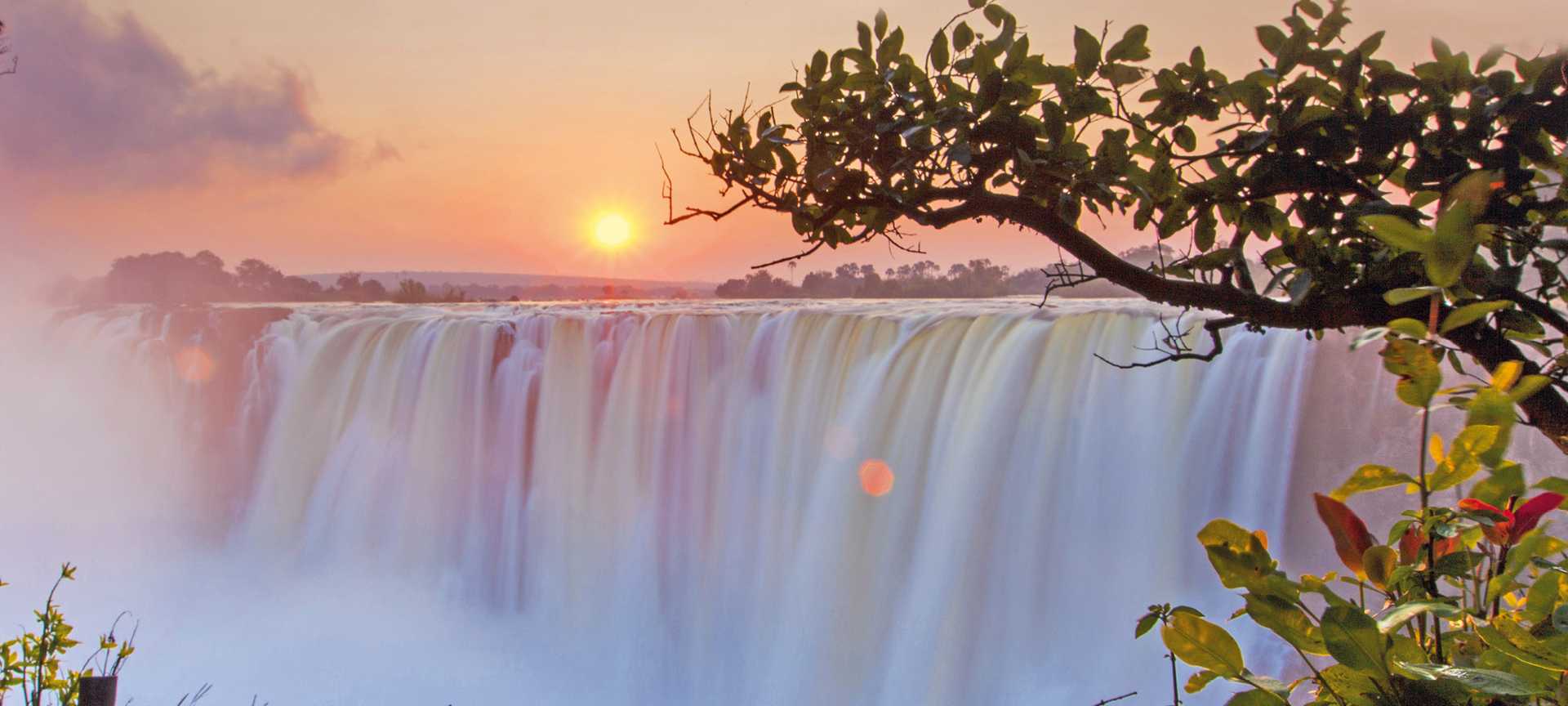 The sun rises over Victoria Falls in Zambia 