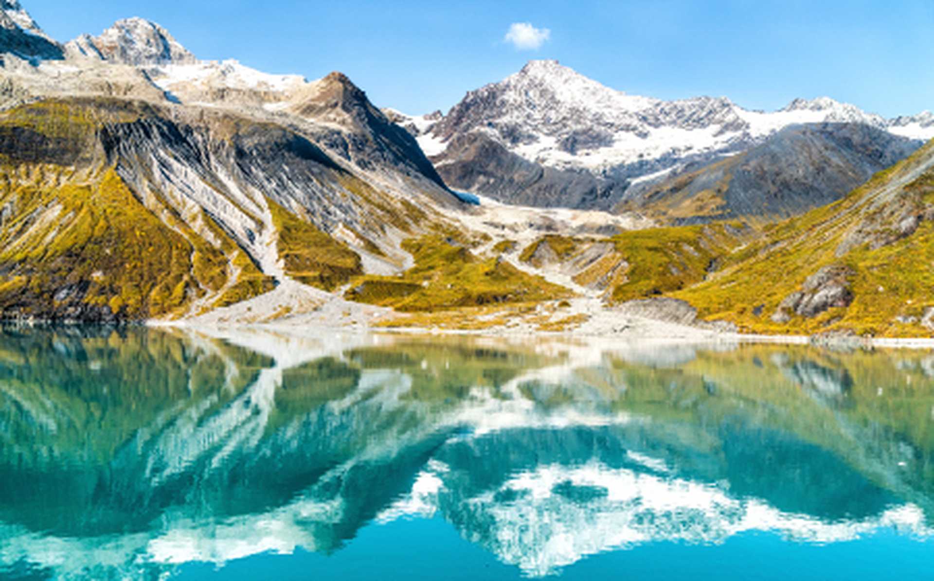 Amazing glacial landscape showing mountain peaks and glaciers on clear blue sky summer day in Glacier Bay National Park, Alaska, USA 