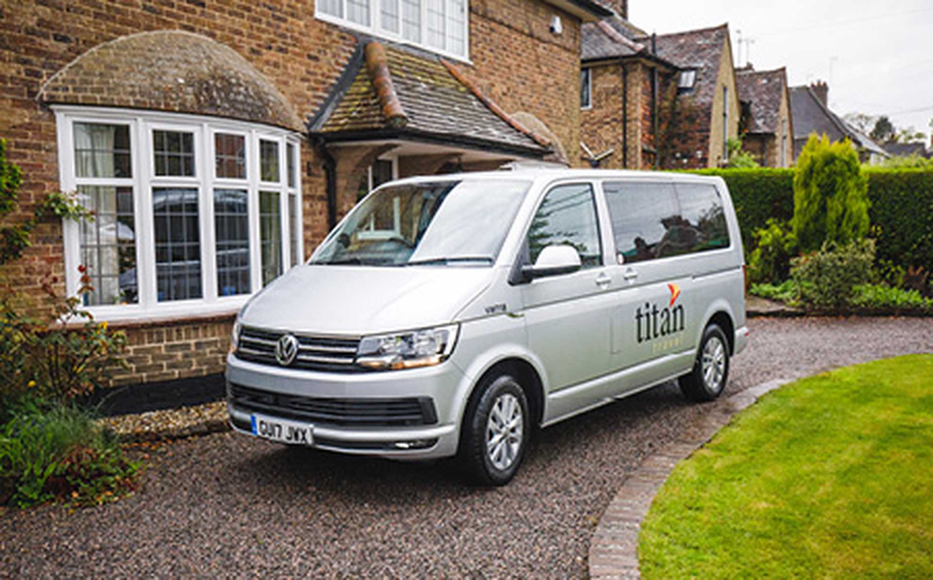 Titan's VIP door-to-door travel service on driveway.