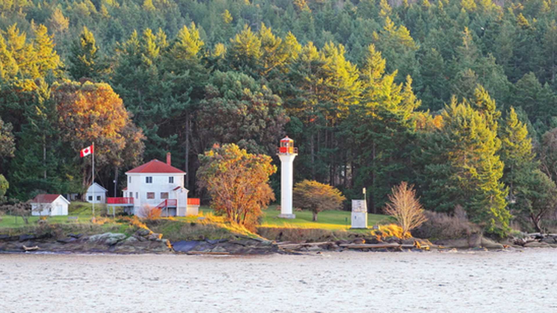Active Pass Light House stands on the edge of Mayne Island in British Columbia, Canada
