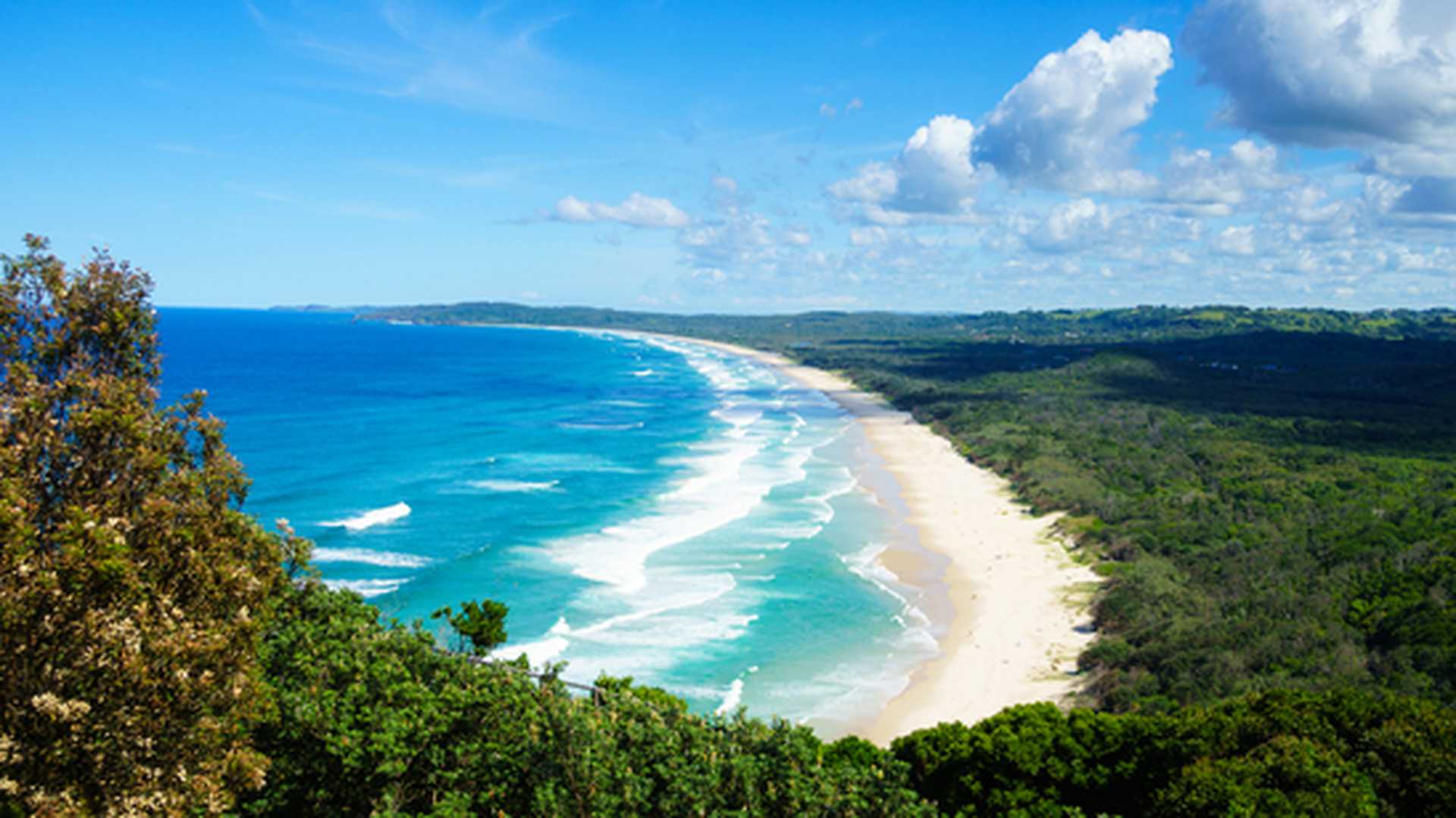 Tallow Beach in Byron Bay, surrounded by the green of Arakwai National Park, New South Wales, Australia