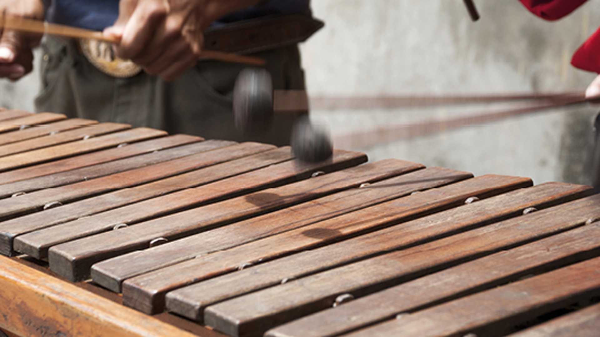 Playing a Marimba. South America
