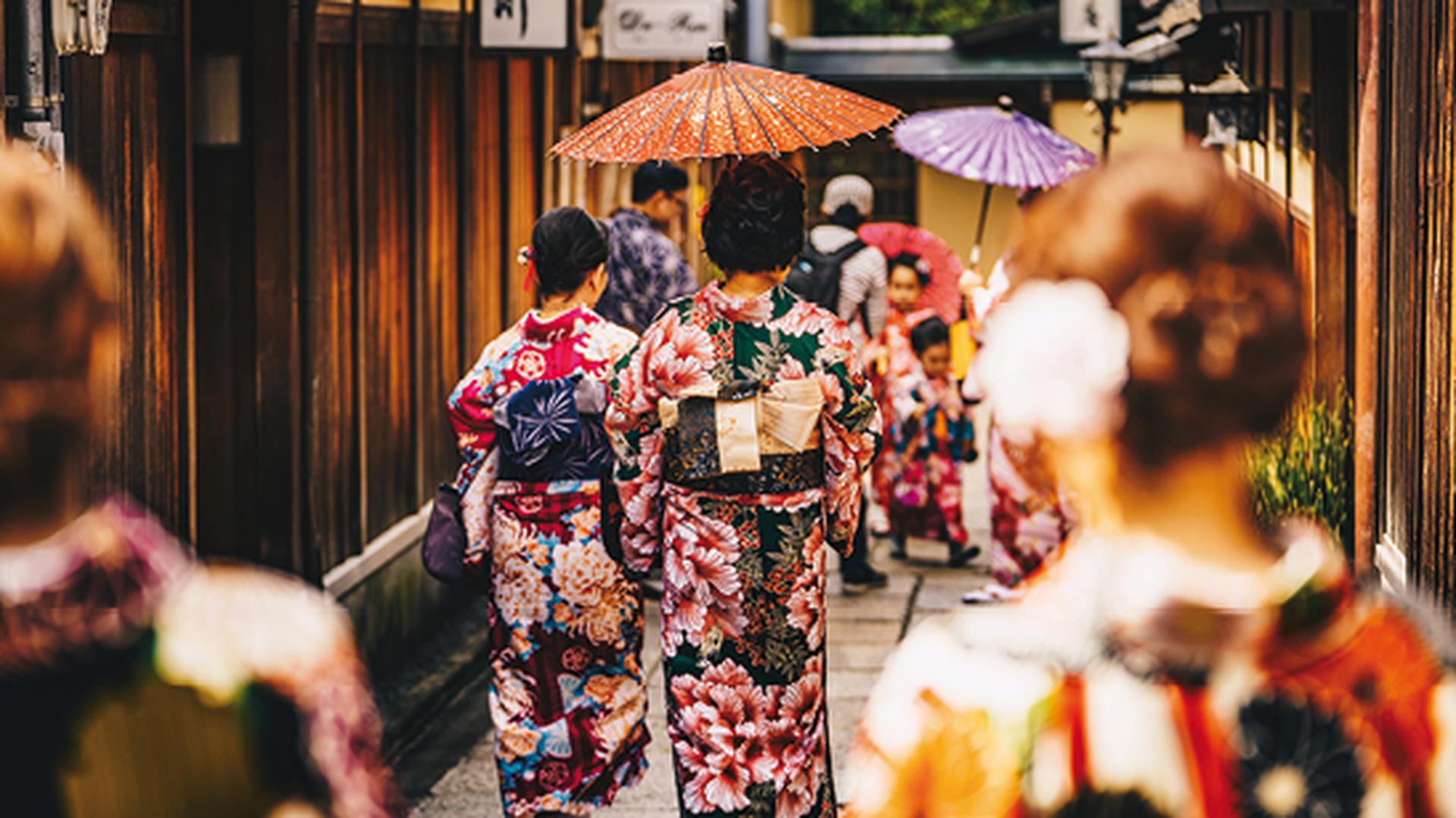 Women in traditional japanese kimonos walking in Kyoto, Japan