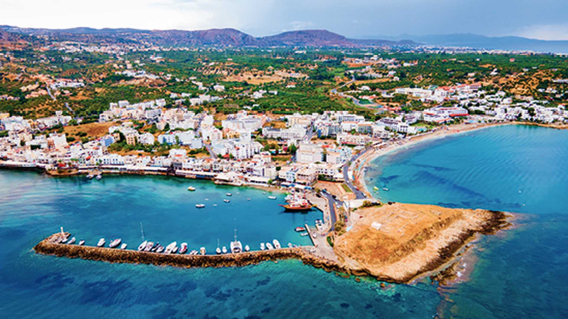 Hersonissos harbor aerial panoramic view. Crete, Greece
