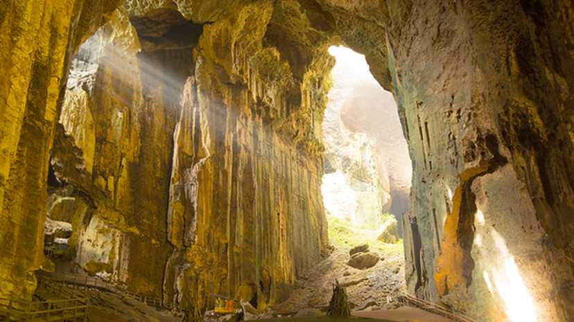 Sunlight streams into the Gomantong Caves in Borneo