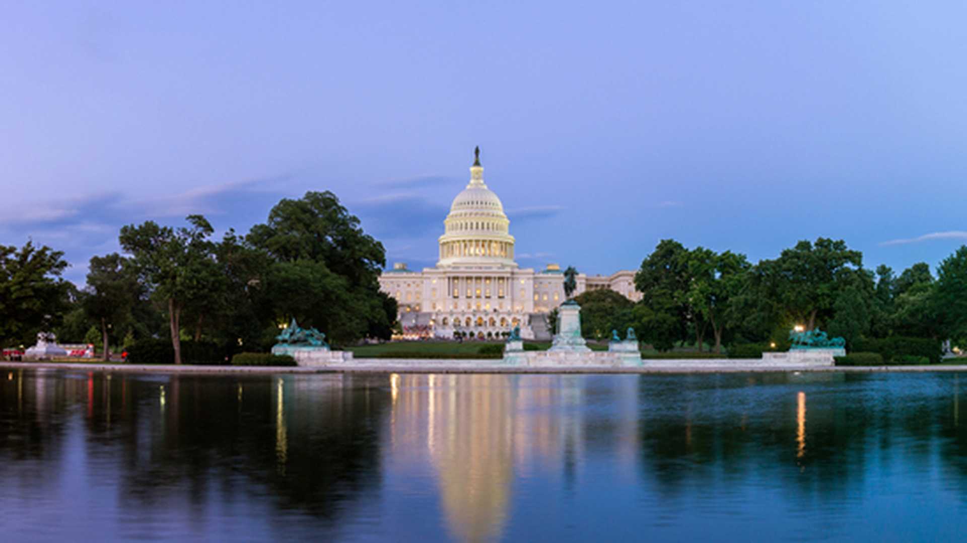 Panorama of the United States Capitol, seen from the the Capitol Reflecting Pool, Washington DC, USA.
