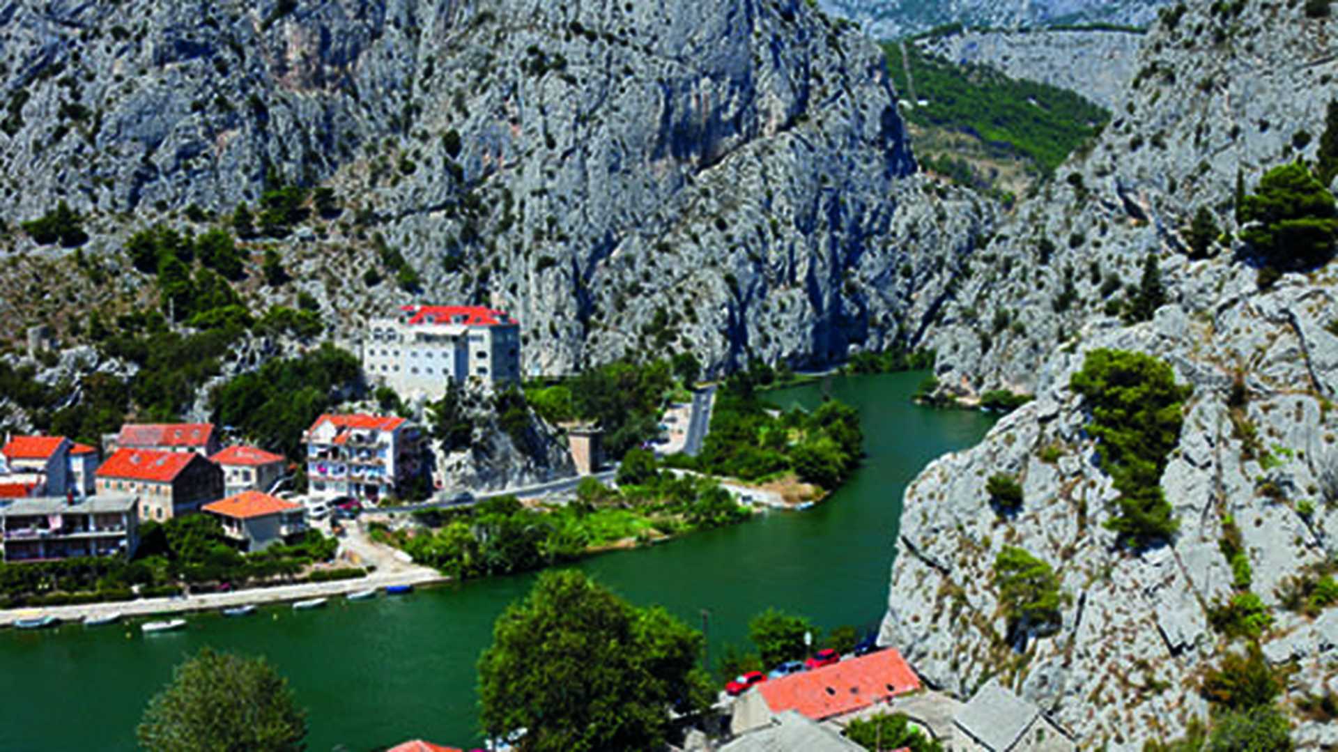 View of the town of Omis with a lake running through, Croatia