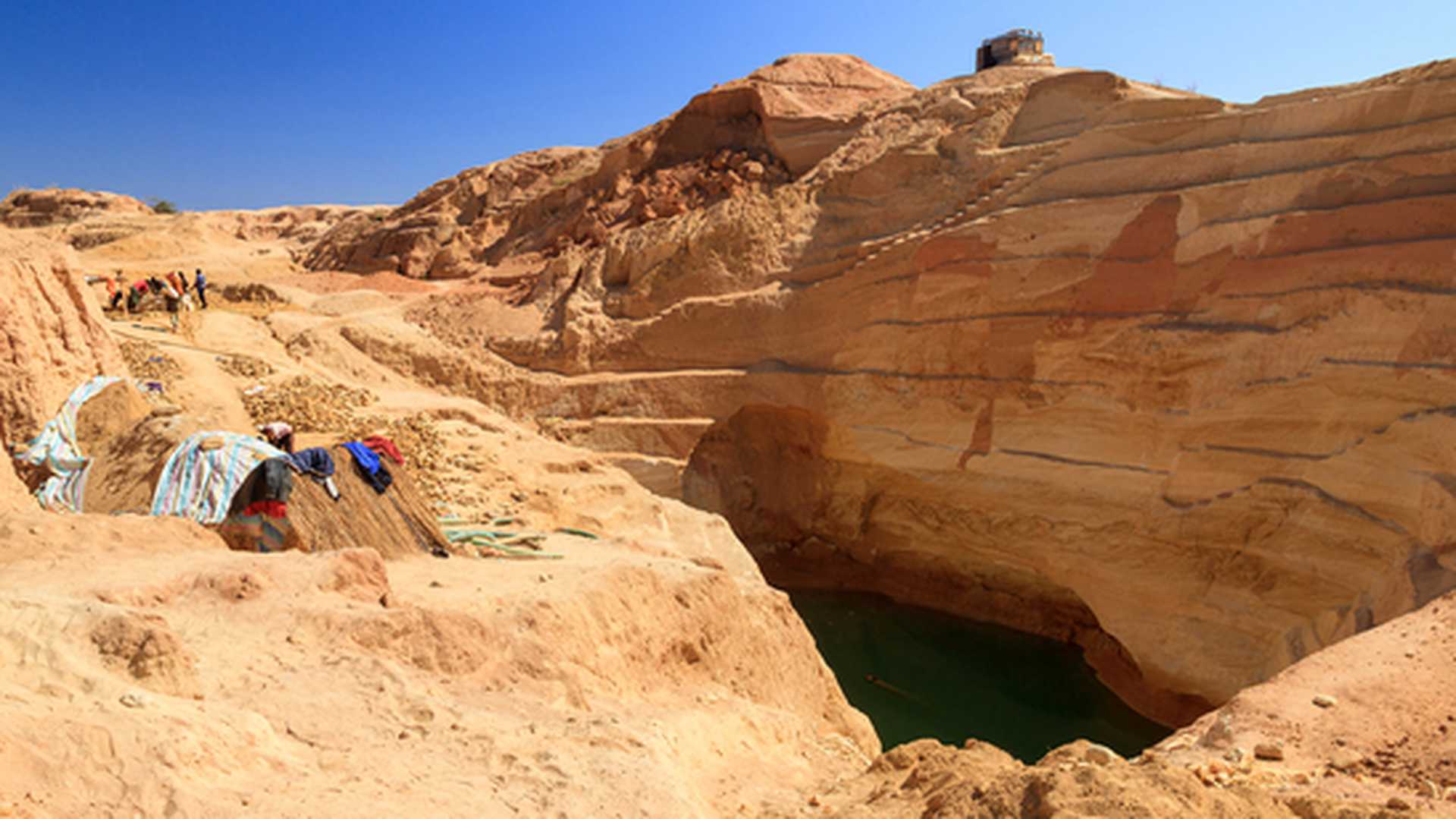Large and dangerous sapphire mine in Madagascar on a clear day