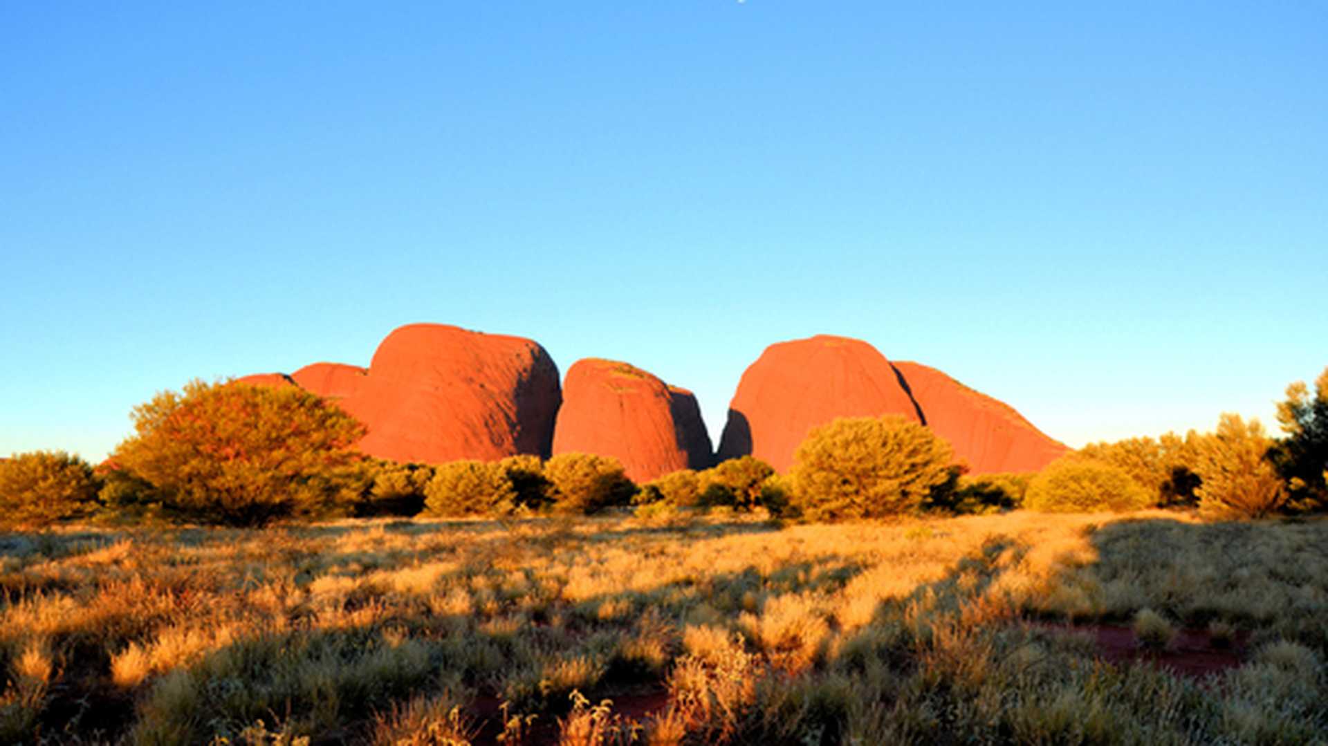 Sunset over the Olgas rock formation (also known as Kata Tjuta) in Australia's Red Centre