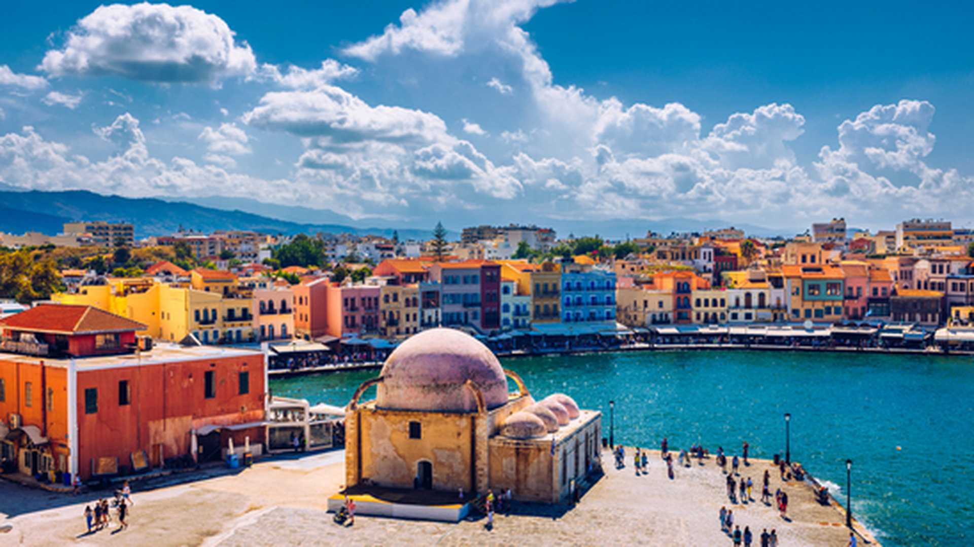 View of harbourside buildings and church in Chania, Crete