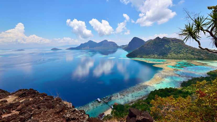 Beautiful coral reefs fringe Bohey Dulang Island, Sabah Borneo, Malaysia