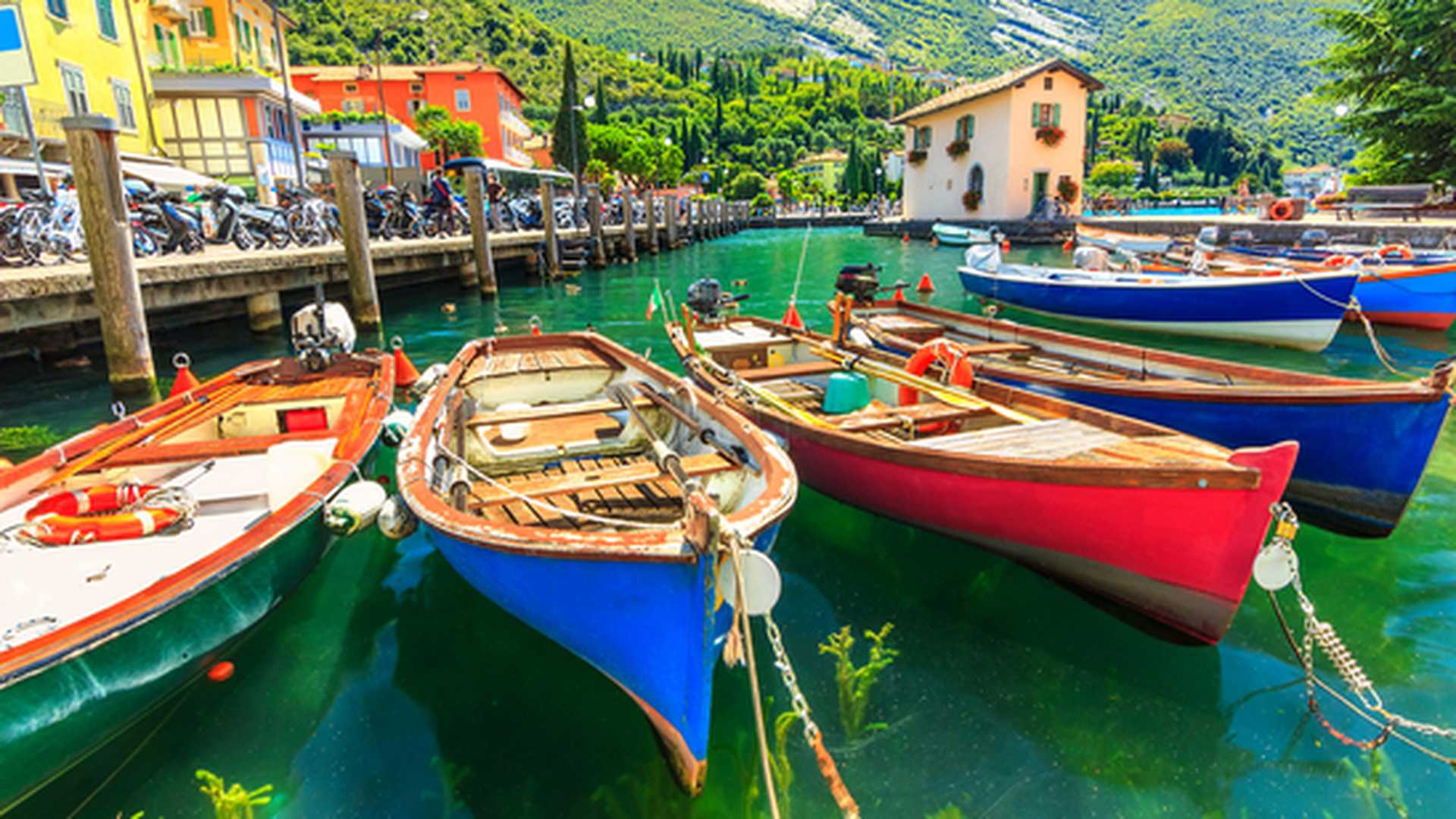 Summer landscape and wooden boats,Lake Garda, Torbole town,Italy