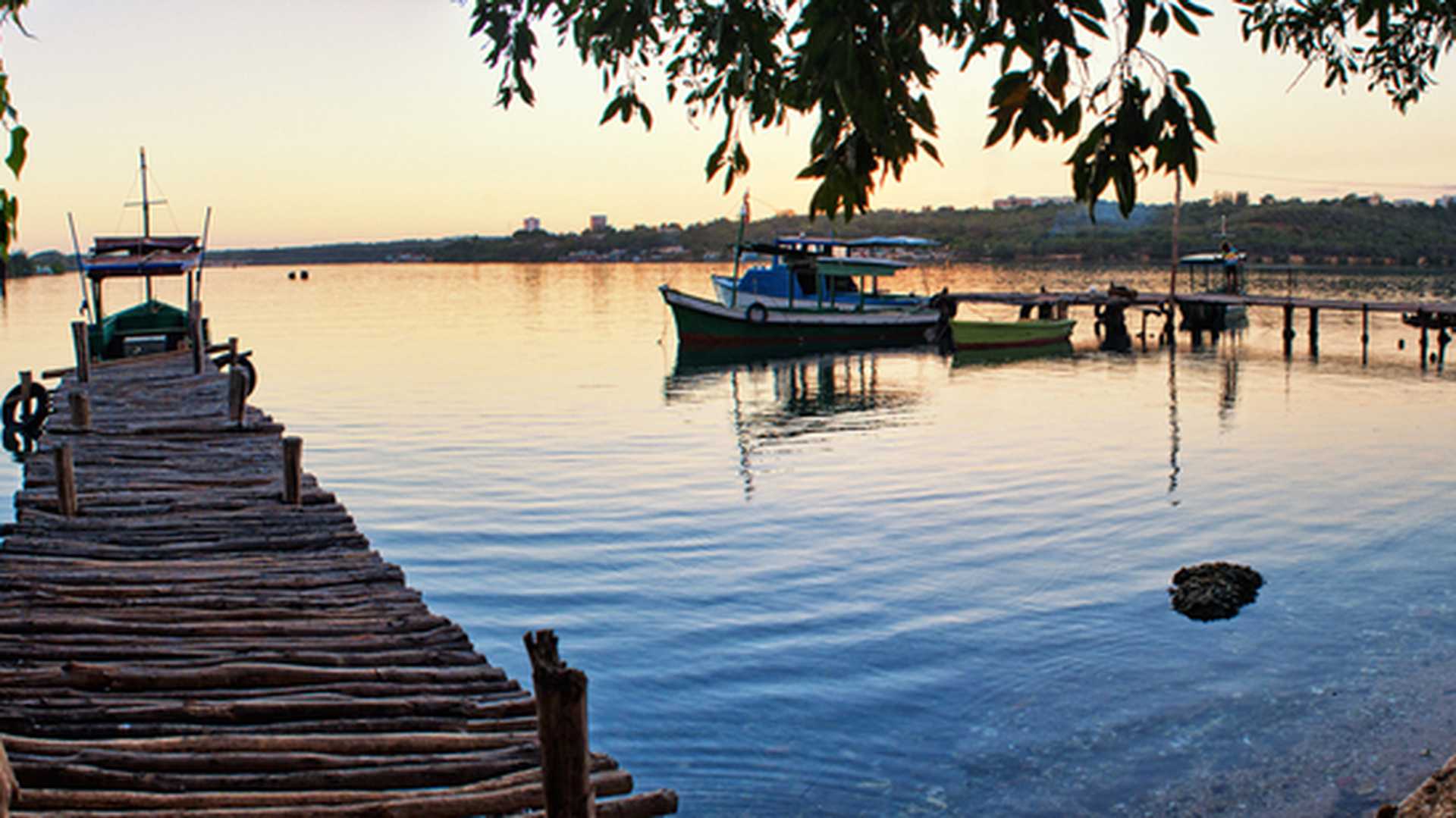 Mini marina and fishing boat in Cienfuegos Bay, Cuba