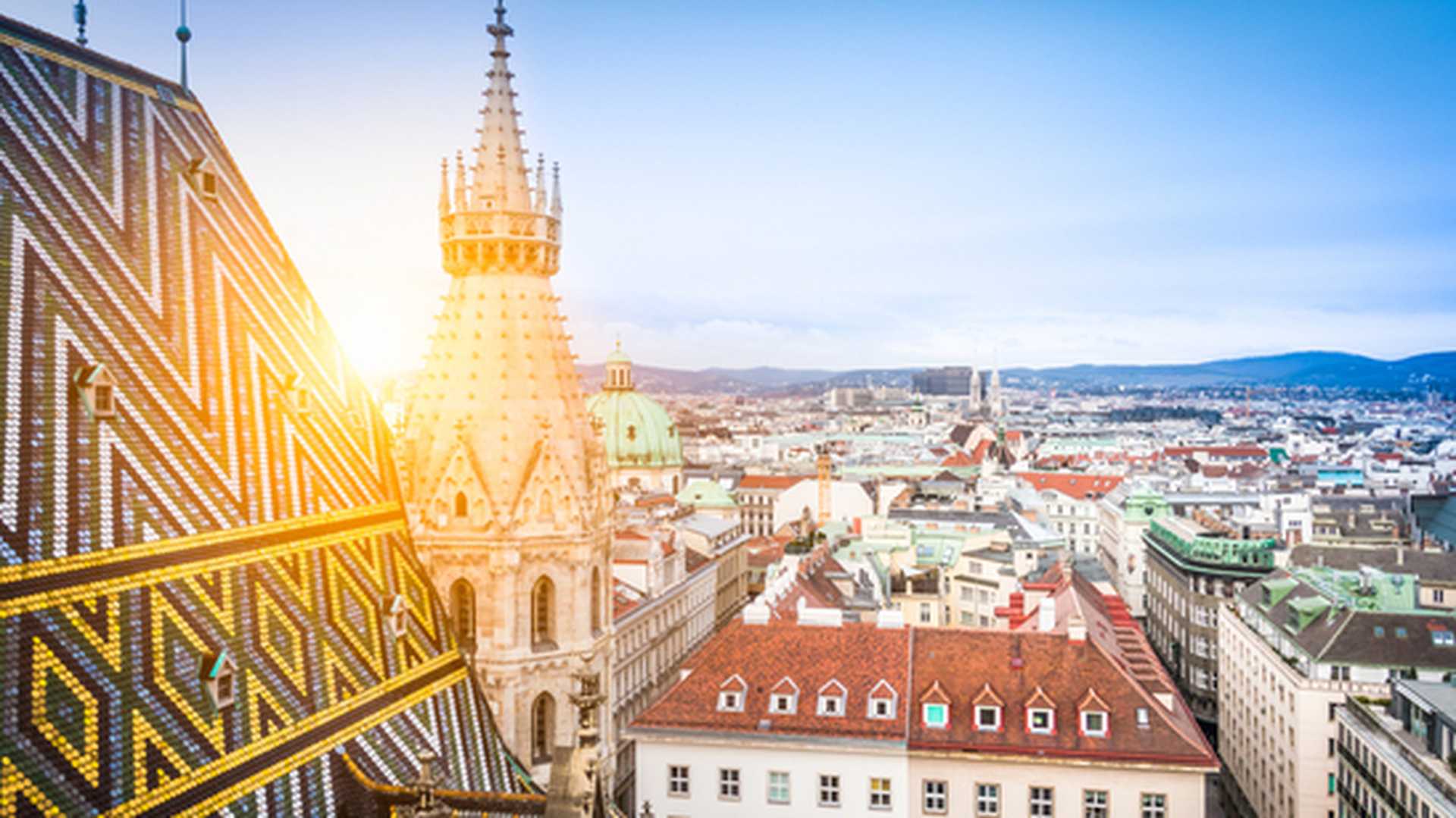 Aerial view over the rooftops of Vienna from the north tower of St. Stephen's Cathedral including the cathedral's famous ornately patterned, multi coloured roof, Austria