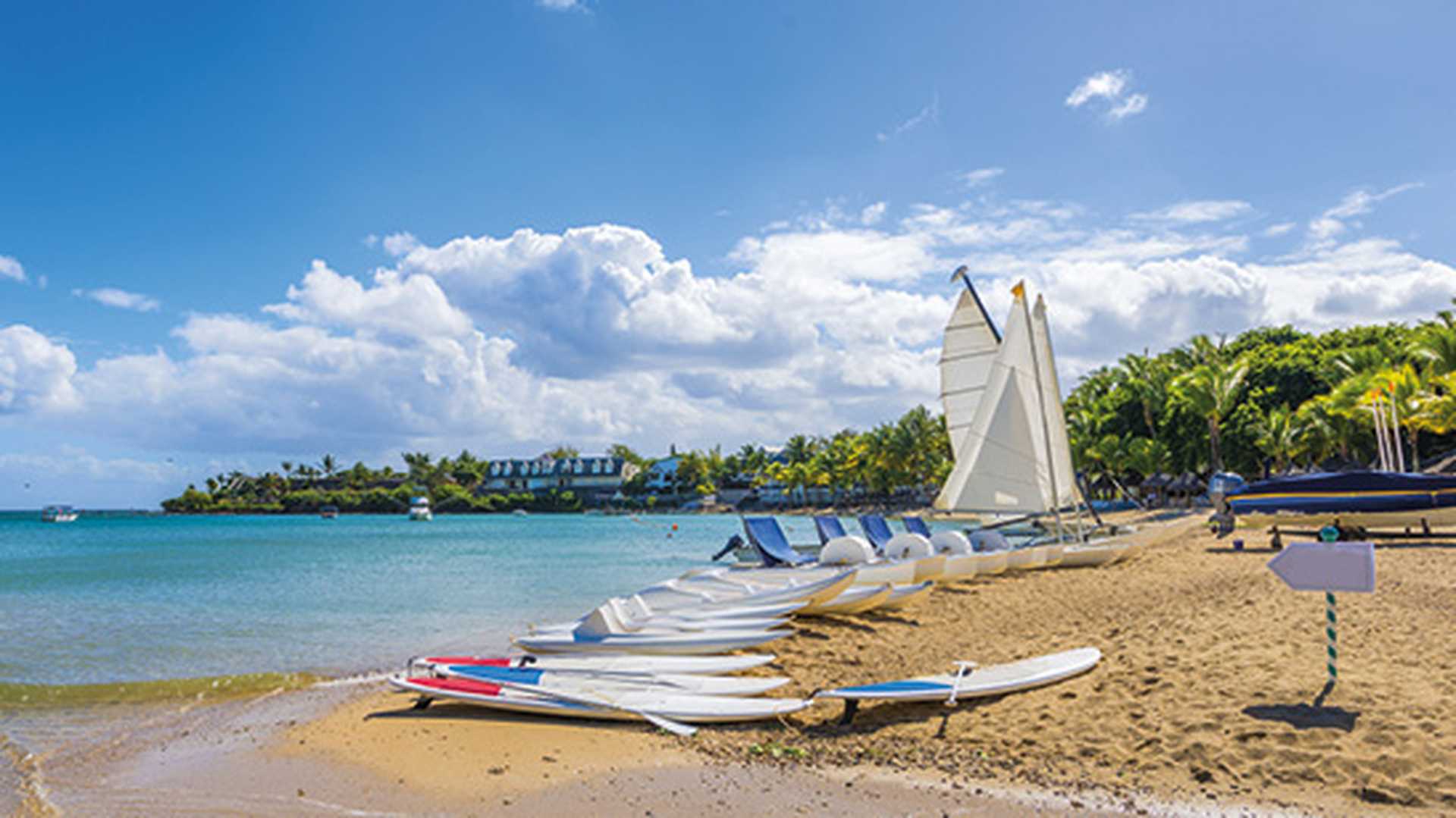 Sandy beach with boats, Turtle Bay in Balaclava, Mauritius