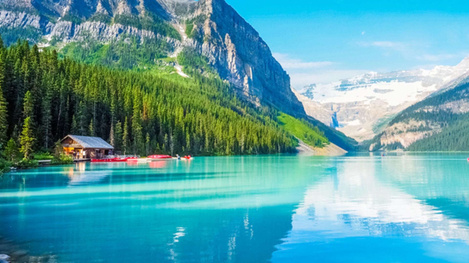 Turquoise Lake Louise, edged by forests and mountains, in Banff National Park, part of the Canadian Rockies