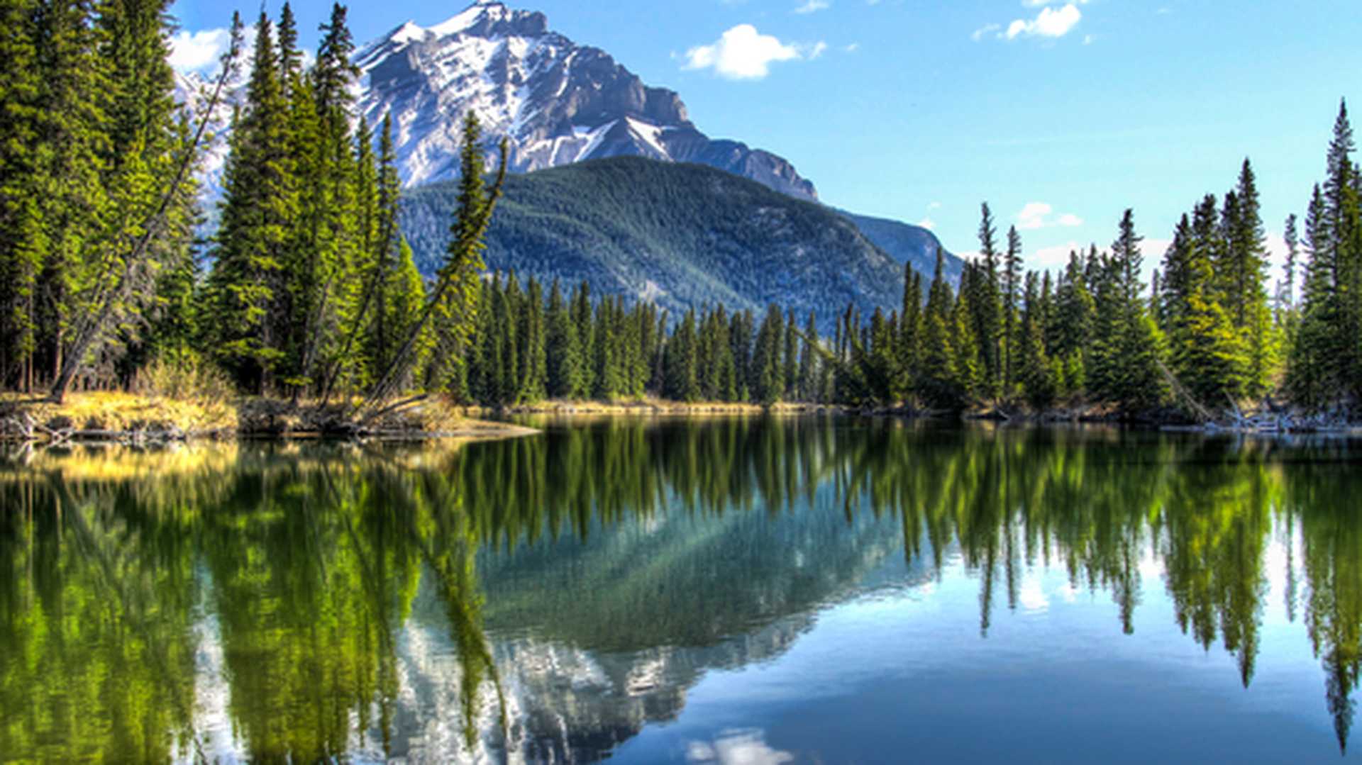 This is Cascade Mountain seen from the edge of the Bow River in Banff National Park, Alberta, Canada.