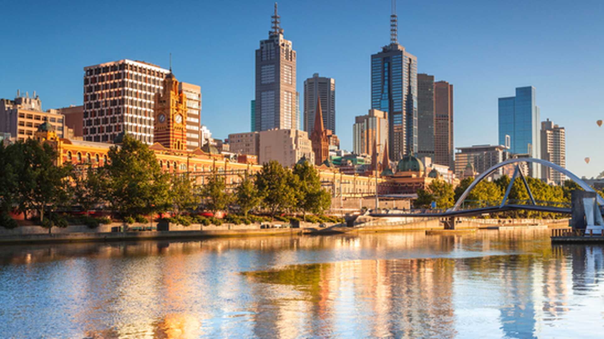 A view of Melbourne's skyline across the Yarra River, looking towards Flinders Street Station 