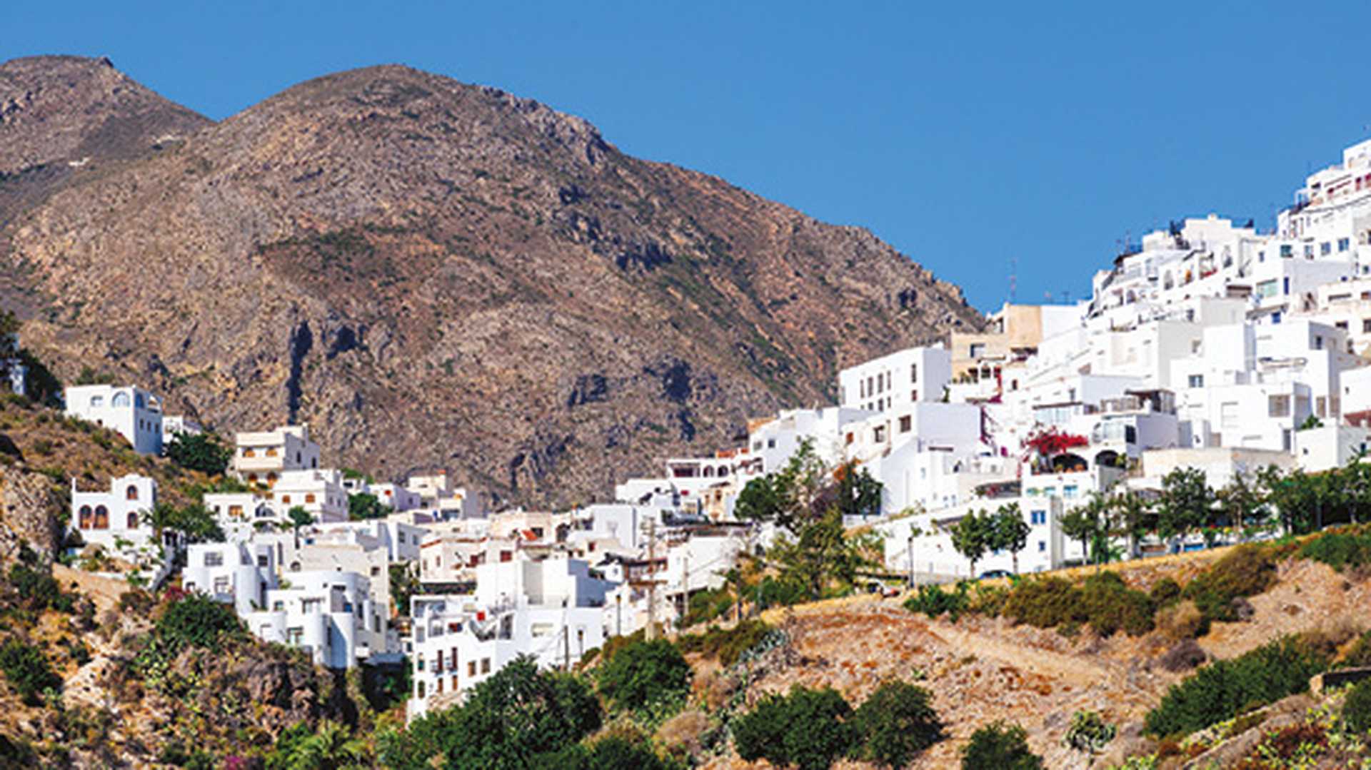 White-washed houses of Mojacar village on hillside, Spain