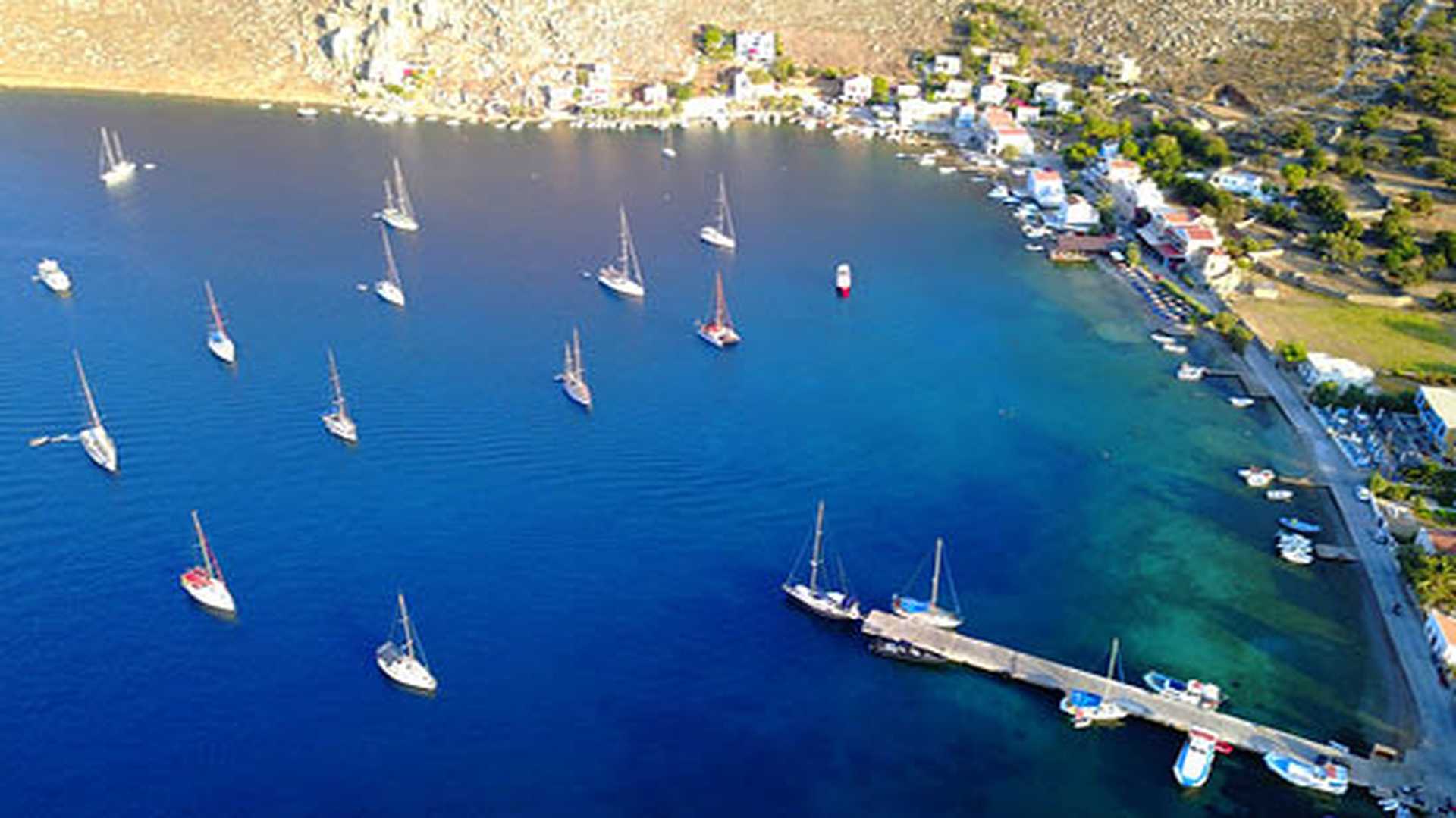 Aerial view of the natural bay of Pedi, Symi island, Greece