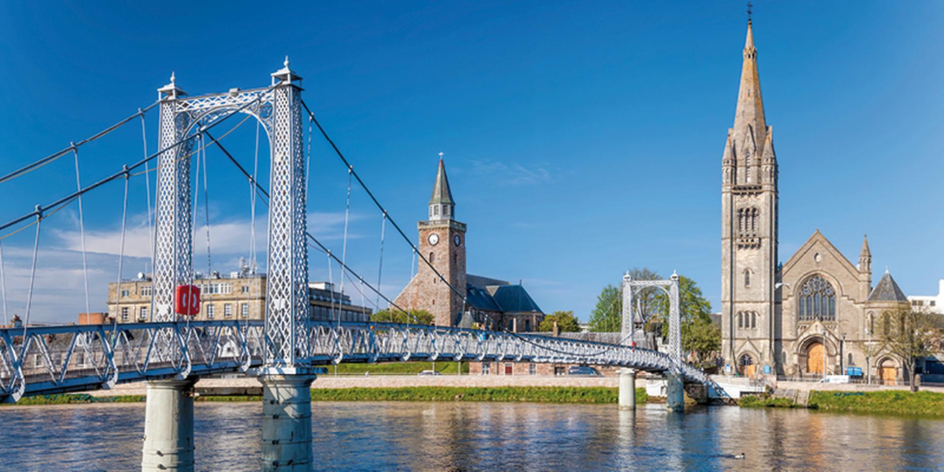 Inverness city with bridge over Ness river in Scotland