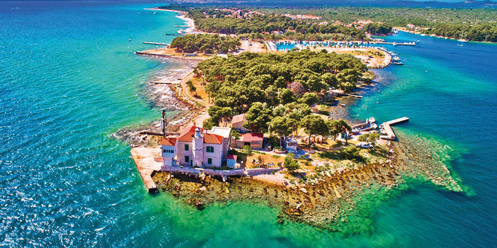 Jadrija lighthouse in Sibenik bay entrance aerial view, archipelago of Dalmatia, Croatia